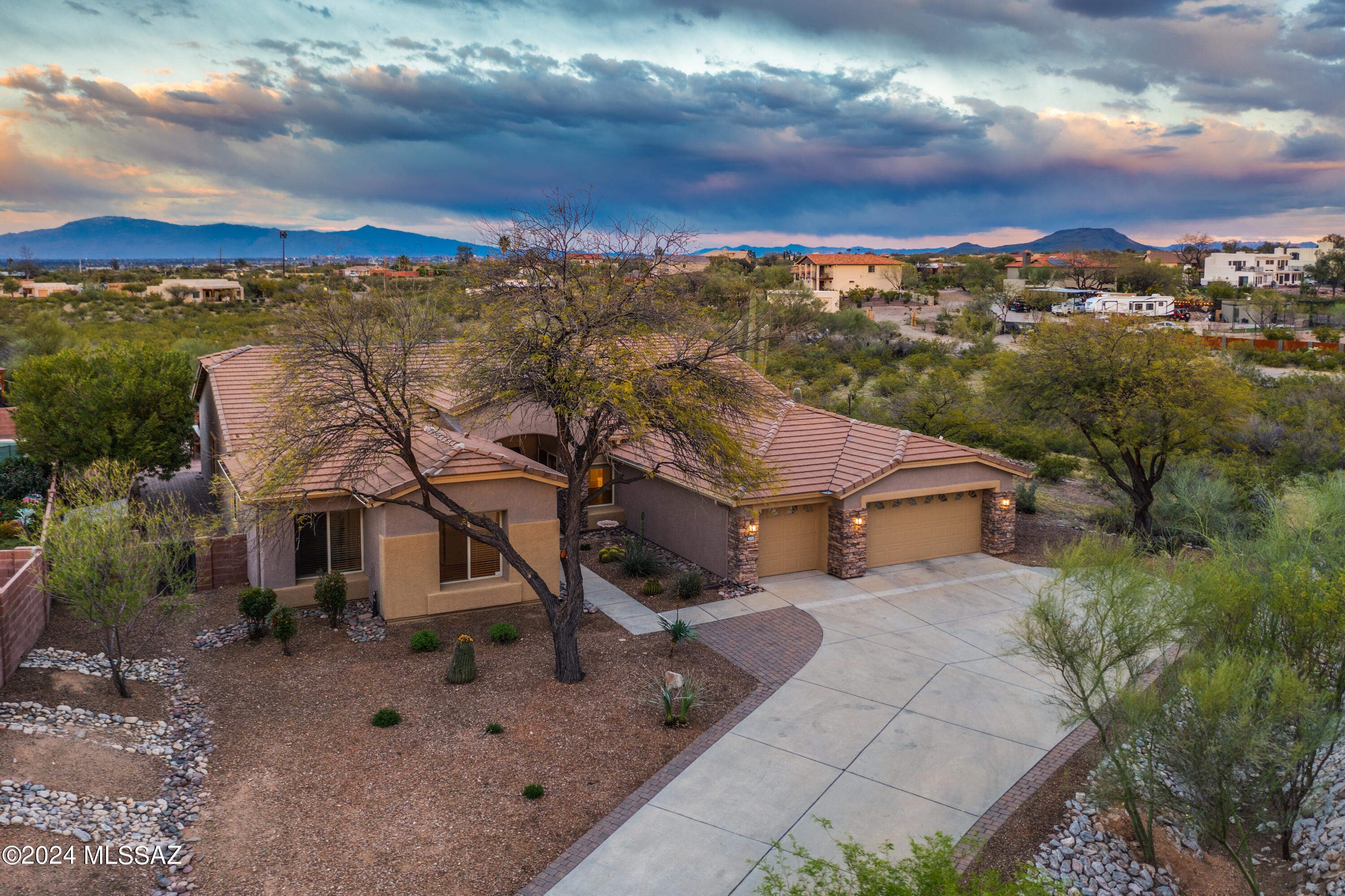 Excellently maintained, large suburban desert home nestled in gated Sweetwater Reserve on Tucson's Westside - conveniently located minutes away from world-class shopping, dining, entertainment, and recreation.

Distinctive layout features spa-style Owners Suite with deep soaking tub, separate standing shower, twin-vanity, walk-in closet, and private access to back patio. Three additional bedrooms, plus another full bathroom and one half-bath, reinforce preferential value & practical utility.

With spacious, east-facing, fully-enclosed resort-style backyard and covered patio - along with pool, outdoor shower, built-in gas BBQ, and gas fire pit - this property is ready for you to make all your own. Extended 3-car garage (plus extra storage space), and long, extended driveway all offer terrific versatility, while providing ample private parking.

Notable recent upgrades include full interior & exterior paint, new outdoor ramada/gazebo, new turf grass, new pavers, new pool pump, new irrigation, new water softener plus kitchen RO system, new dishwasher, and new high-efficiency LED lighting - see attached list for details (improvements totaling $60k+).

This dynamic property can be a stellar starter for first-time homebuyers, an exciting change of space for seasoned homeowners, or a potential income-producing asset for savvy investors.