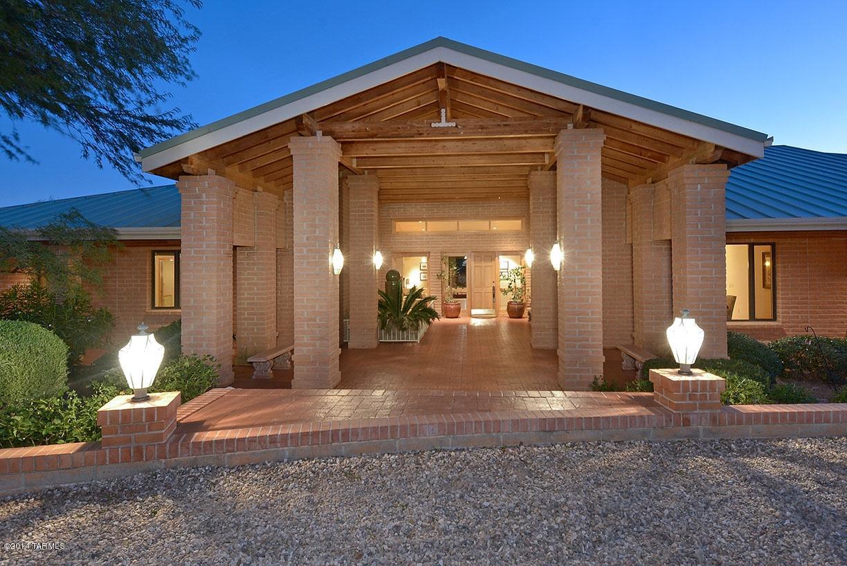 WINNER OF THE COVETED TAR BROKER TIYR AWARD!!This gated property provides a unique and timely opportunity for the fortunate buyer. Timeless architecture showcases soaring ceilings, huge bright open spaces, excellent materials. Stunning hard rock maple used consistently throughout the home in  cabinetry, doors and trim. Remarkable storage, workout room and Sufficient pantry space for years of food supplies. This property would make an exceptional horse property and is the setting for an outdoor lifestyle. Perfect for a large family or an extended family. Two separate lots. A value added is a well with 50gpm rate plus city water.Self sufficient lifestyle close to town. Taxes on Vacant lot which is included in the sale are 2107 per yr and are not included in the taxes noted above