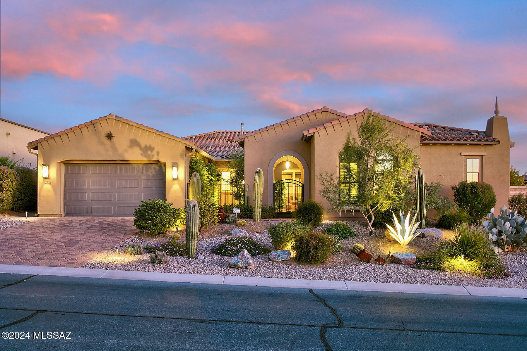A Toll Brothers built home located in the gated enclave of Los Saguaros in Dove Mountain, featuring a spacious split floor plan w/ 2 large primary suites, 3 full baths, custom office w/ built-in cabinetry. Gourmet kitchen includes a Wolf cooktop & oven, oversized island, custom cherry cabinets, granite counters, & butler's pantry. Both primary bedroom suites are generous-sized w/ luxe ensuite baths walk-in showers, soaking tubs and California Closets. Incredible backyard retreat w/2 covered patios, extensive travertine pavers, heated Pebble Tec pool, putting green, gas fire pit, new built-in BBQ, and ez-care artificial turf. Additional features include a 3-car tandem garage with custom-painted floors & abundant storage systems, plus 2 new A/C units & fresh interior/exterior paint. WOW