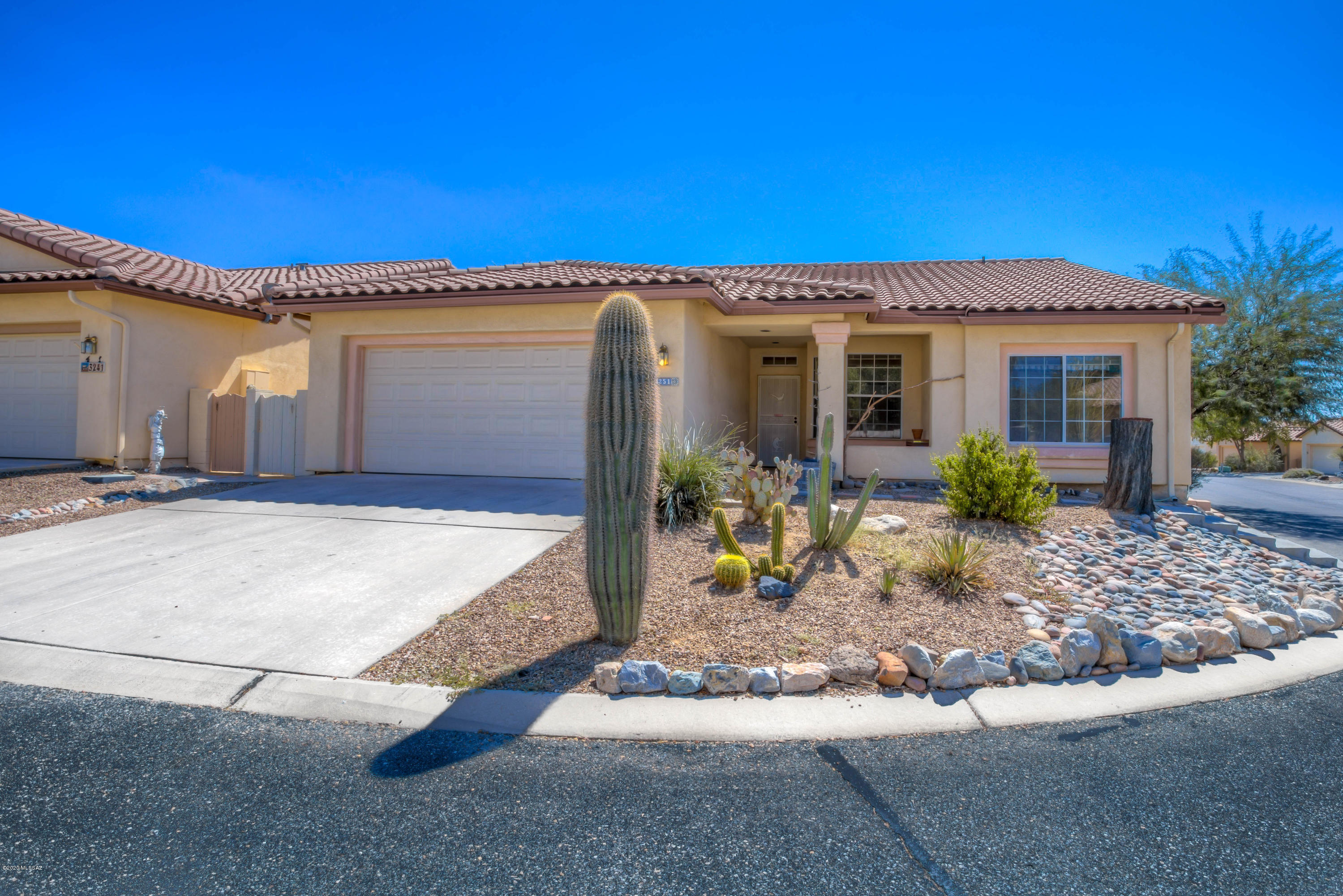 Welcome to this beautiful home in the highly desirable North Ranch community! Featuring 1,663 sq.ft., 2 bedrooms PLUS a large Den with double doors, 2 full bathrooms, split floor plan, spacious Living Room, top-down-bottom-up window shades, privacy/UV window tint, Kitchen with new flooring, new stainless steel appliances, RO system at sink and a bright Breakfast Nook! The generous Primary Bedroom features a sliding glass door to the patio, en suite bath with large vanity and walk-in closet.   The garage is complete with built-in cabinets, work bench and washer/dryer.  Venture out back to enjoy the serene rear yard with covered patio, extended pergola shade structure, flagstone and natural vegetation.  Be sure to ''walk'' through with our 3D Tour under the Photos tab!