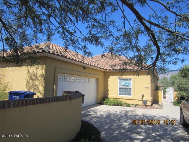 Incredibly convenient location in Central Tucson that is newer Construction. This home is located in a little enclave of 4 homes that were built in the mid 2005 time frame. You will need to bring your ideas to this one. Incredible floor plan with 3 very nice sized bedrooms with a split bedroom floor plan. Large Great Room with fireplace and sliding glass door to a large covered patio. Kitchen that opens onto a dining room/family room. Large covered Patio with fireplace that opens onto the yard with a fireplace and slab for a Spa. Master Suite has a fireplace also and sliding glass doors to the covered patio. 2 car side load garage. Very Nice Floor plan.