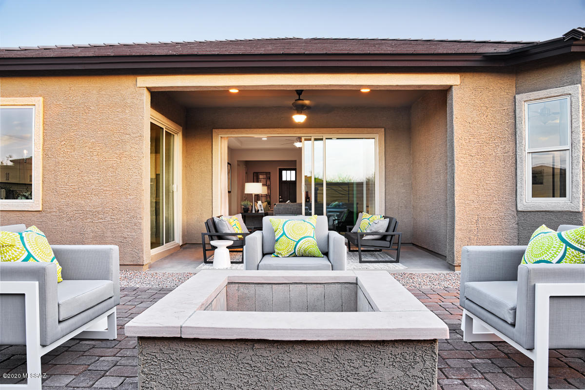 Tour this sprawling ranch-style model home! Guests are greeted by an attractive stone veneer, and the covered entry leads back into an open-concept floor plan. There, you'll find a spacious great room, a breakfast nook, a dining room and a kitchen, showcasing a center island, a walk-through butler's pantry, quartz countertops and stainless-steel appliances. Adjacent is the impressive master suite, featuring an elegant tray ceiling, a beautiful bay window and a private bathroom with a walk-in shower and dual sinks. Two additional bedrooms, a versatile teen room and a laundry complete this home. Also includes ceiling fans throughout, a covered patio and a side-entry garage.