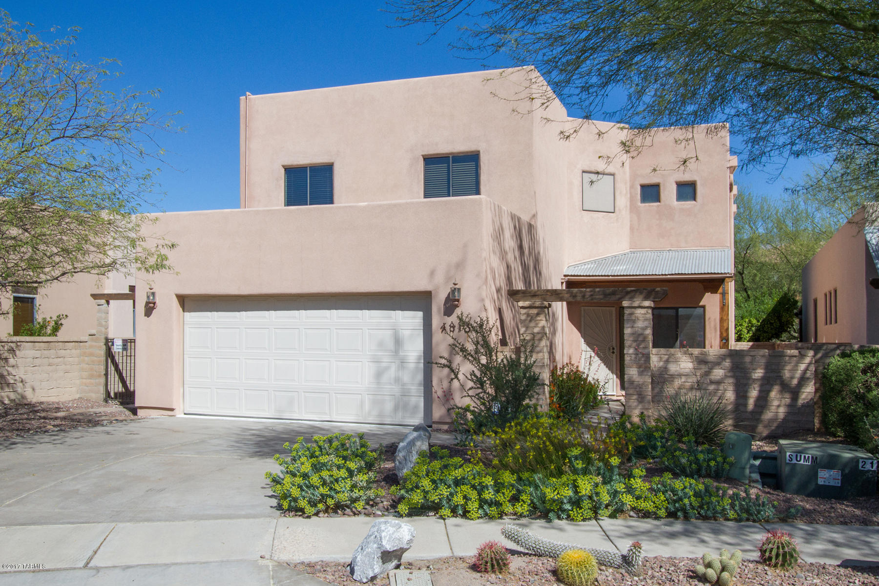 Private Central Gated Community close to the River Walk  Loop. This 4BR/3BA plus Loft Miramonte Home has great Mountain Views, conveniently located to shopping, restaurants, downtown. Enter through a beautifully landscaped, charming courtyard to a pristine open floor plan Great room w firelplace and open island kitchen w SS appliances ideal for entertaining. Soaring ceilings, lots of natural light. Full bedroom/bath on lower level. Luxurious master suite on second level with balcony to take in the Catalina Mountain Views. Beautifully designed back yard.  Don't miss this gem!