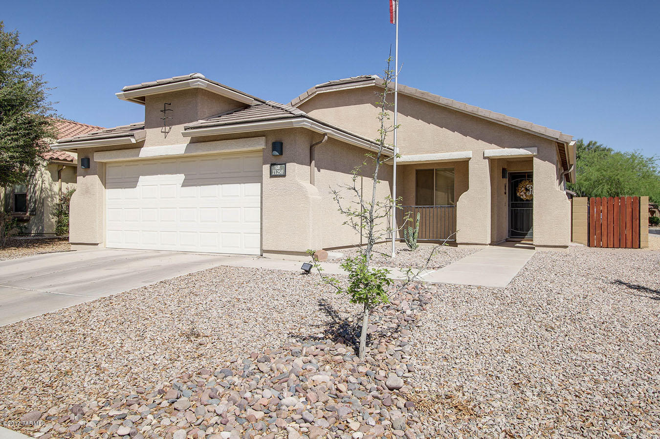 Fabulous affordable contemporary home-move in ready & situated on a huge corner lot!  Special features include: custom interior paint, great room & spacious open kitchen w/all appliances including side by side refrig, maple cabinets, ceiling fans, wood style flooring in kitchen & bthrms, French doors on 3rd bdr, beautifully upgraded m-bath, bay window in mbdr, faux wood blinds, raised panel doors, neutral carpet, cabs in laundry rm,  energy efficient 14 seer A/C (1 yr old), Wi-Fi programmable thermostat,  water softener, cool grass on auto sprinklers, covered patio & front porch, security screen door, situated in a friendly master planned community &  minutes to parks, schools, bike lanes, walking trails, pool w/splash pad and more! EZ access to I-10!