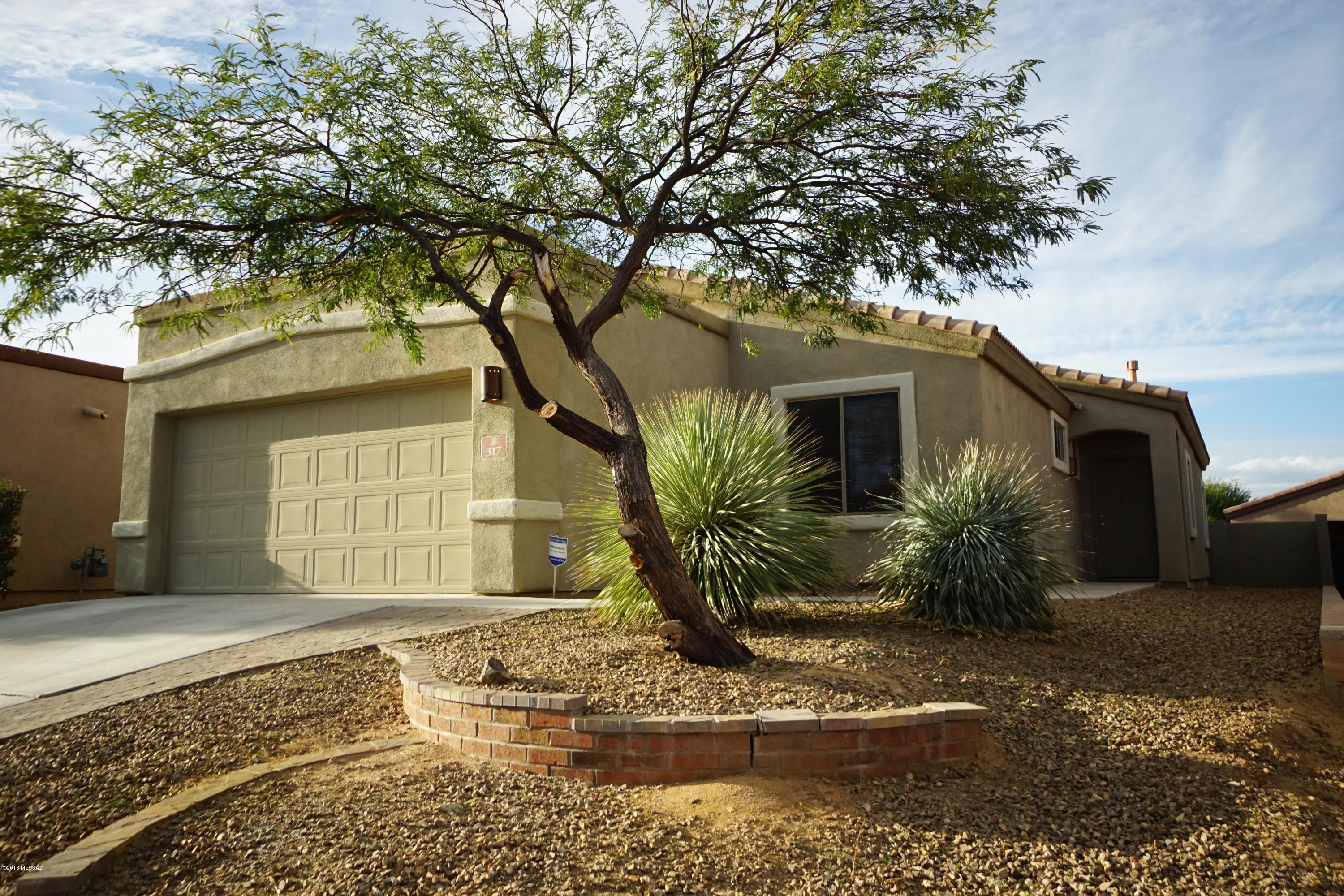Very clean and ready for move in! 3BR/2BA home. Open kitchen with stainless steel appliances, tile dining area and family room with fireplace and built in's. Large master suite, soaking tub & separate shower, double vanity & a lot of natural light. New carpet, neutral paint throughout. Extended covered patio, fully enclosed back yard and an extended (deeper) 2 car garage. Located in popular Rancho Sahuarita including access to lake, clubhouse, gym, water parks/pools, parks, etc. A real nice home in a fantastic community!