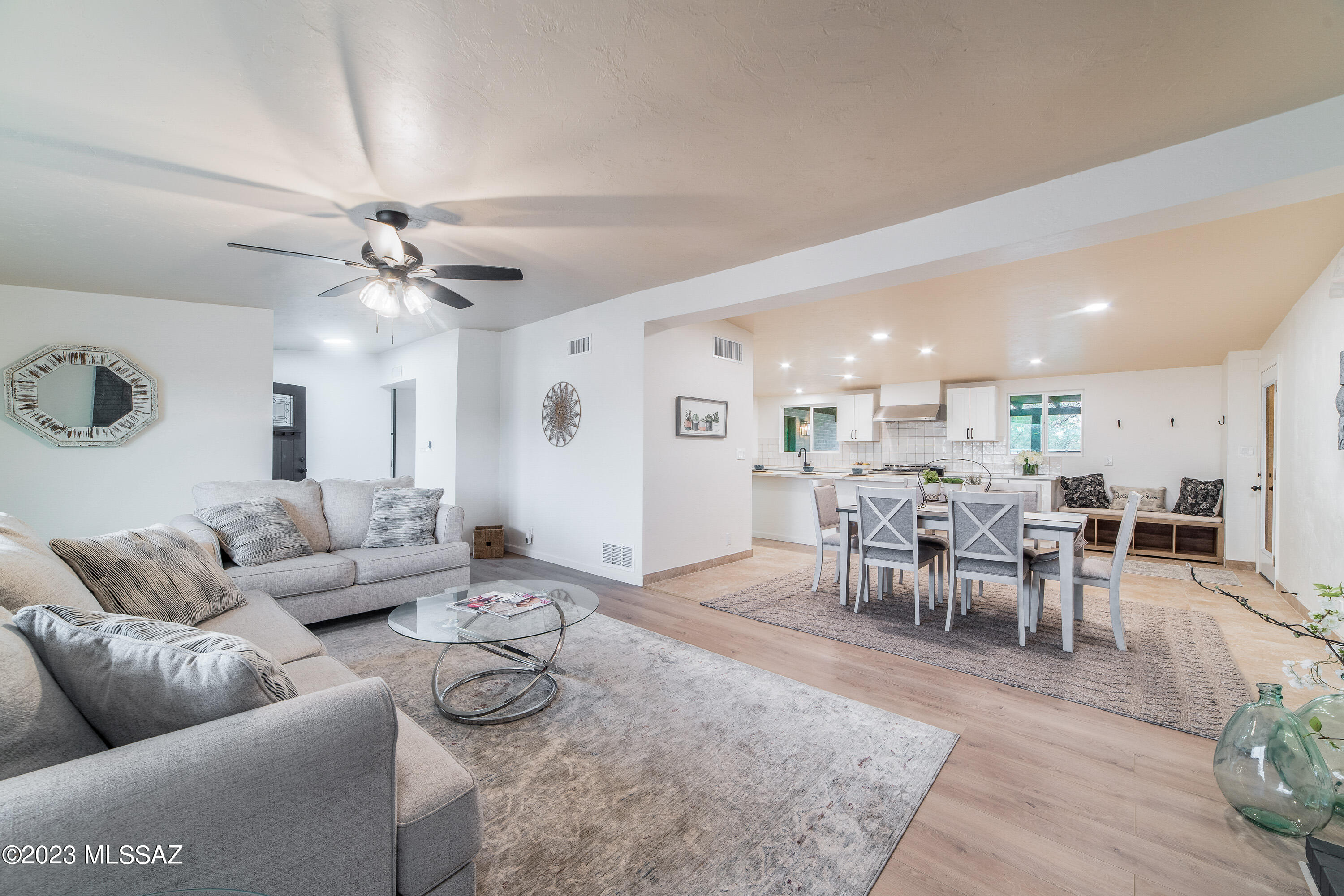 Beautiful remodeled single level home in Casas Adobes Estates. Great location with shops, grocery, and restaurants nearby. All new kitchen with large walk-in pantry and quartz counters. 36'' chef's range and hood. Large living room with fireplace off front entry. Sunken family room with 1/2 bath off kitchen. Four bedrooms + den with sliding glass barn door. New baths with all new tile, cabinets, and light and plumbing fixtures.  All new dual pane windows and exterior doors. Two HVAC units (one brand new and the other two years old). Front yard has large, gated private courtyard with lighted walkway to entry. Backyard has gated pool and two large grassy areas.  EZ conversion to drip sprinklers if grass not wanted. Big lot with plenty of space for extra toys with no HOA. Seller is owner/agen