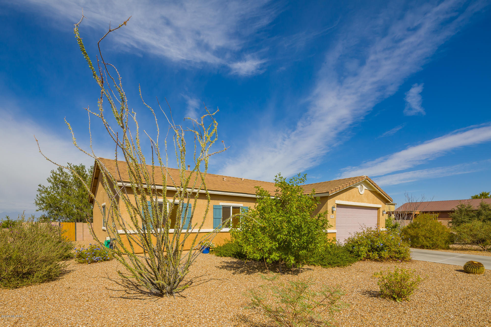 Look no further! This well maintained home with unobstructed Catalina Mountain views is sure to win your heart.  The super clean  & cheerful home features an open concept floor plan with living & dining room open to the kitchen. Neutral 18'' tile floors in the foyer, kitchen, & dining.  Living Rm set accented w/ laminate wood floors. Kitchen has a center island, maple cabinetry, gas range & the stainless Whirlpool refrigerator conveys. Convenient laundry room off kitchen includes the gas dryer & washer. Three spacious bedrooms plus a den. Private backyard is an entertainers delight! Covered flagstone patio plus a retractable awning, built in BBQ with Jenn Aire gas grill & extra gas burners. Hot Tub conveys. No homes behind you and the views are spectacular!  Brand New 2020 HVAC. A Must See