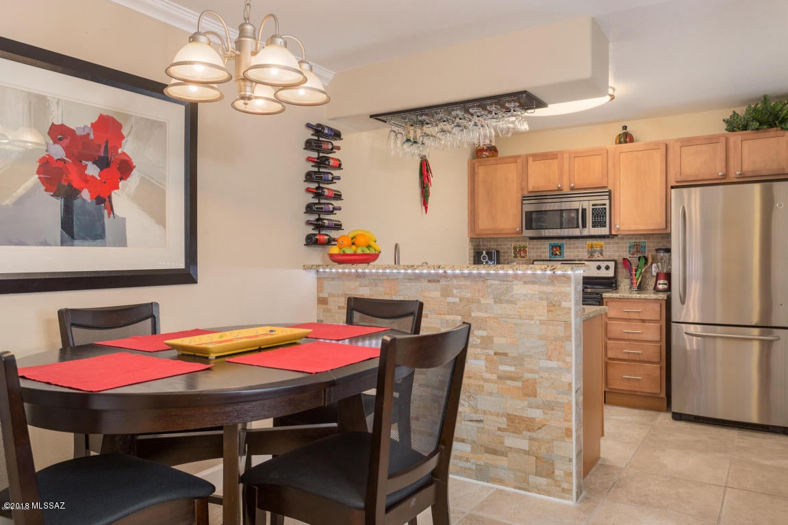 Nestled within the shadow of the Santa Catalina Mountain Range, Veranda at Ventana is seemingly away from it all, but super close to all the conveniences! This Unfurnished 1 bedroom 1 bath condo has tile everywhere including patio, upgraded kitchen with granite counter tops, maple cabinets, tiled back splash and bar, reverse osmosis to sink and ice maker and stainless steel appliances. Available for July 2018 move in.!