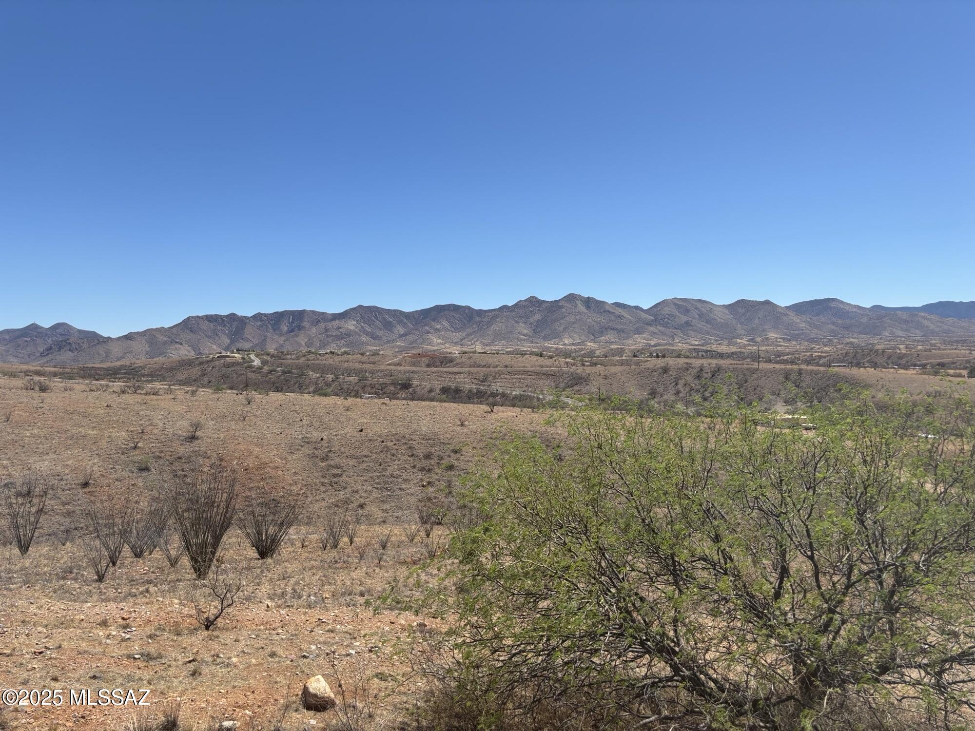 VIEWS Surround You ! Located on a quiet cul-de-sac off paved roads, this 7+ acre parcel showcases stunning views of the Patagonia mountains. Just minutes from Lake Patagonia & a short drive to Nogales for shopping. Perfect opportunity for those seeking serene surroundings & breathtaking landscapes.
