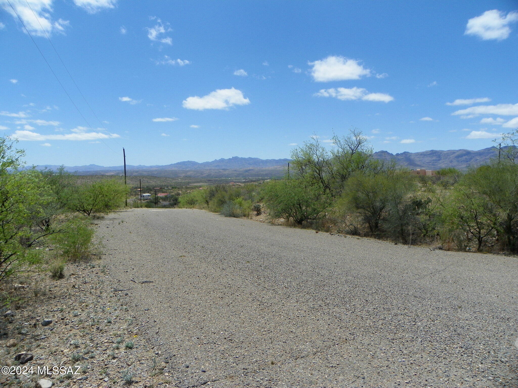 Residential lot with Electric, water and sewer at the street.  All paved access.  Mountain views.  Uphill slope to the lot but buildable.