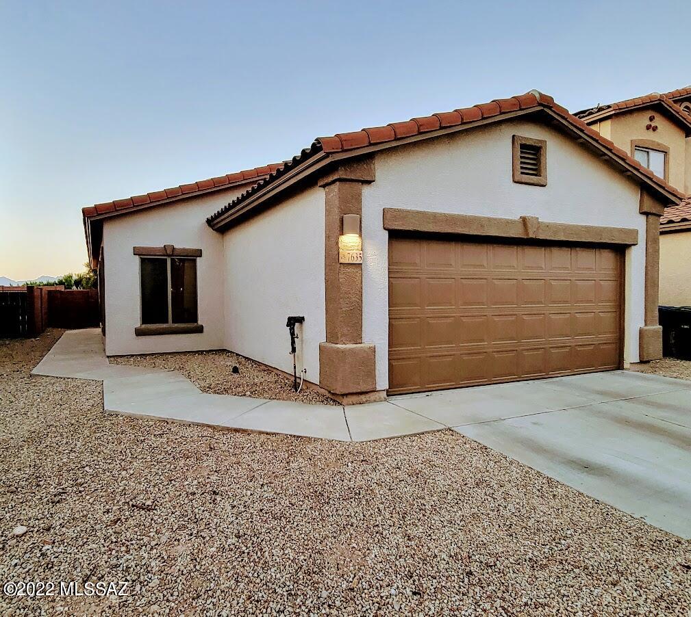 Enjoy this open floorplan, gorgeous backsplash & granite counter tops, tons of cabinets for storage, stainless appliances, and under cabinet lighting. Pony wall separating dining area open to family room. Split bedroom plan. Owner's suite with walk-in tiled shower. Ceiling fans in all rooms! Large laundry room with washer and dryer. See the majestic Rincons from the backyard, which is a blank canvas for the buyer to personalize.  The house is all electric with solar lease at $102 per month.  Neighborhood dog park, BBQ area, ball field and walking trails. New A/C and some fans 2021. Owner's bath remodeled, kitchen backsplash & water softener 2020. Exterior painted 2017. Carpet, pad, fridge, stove, washer, dryer and interior painted 2016.