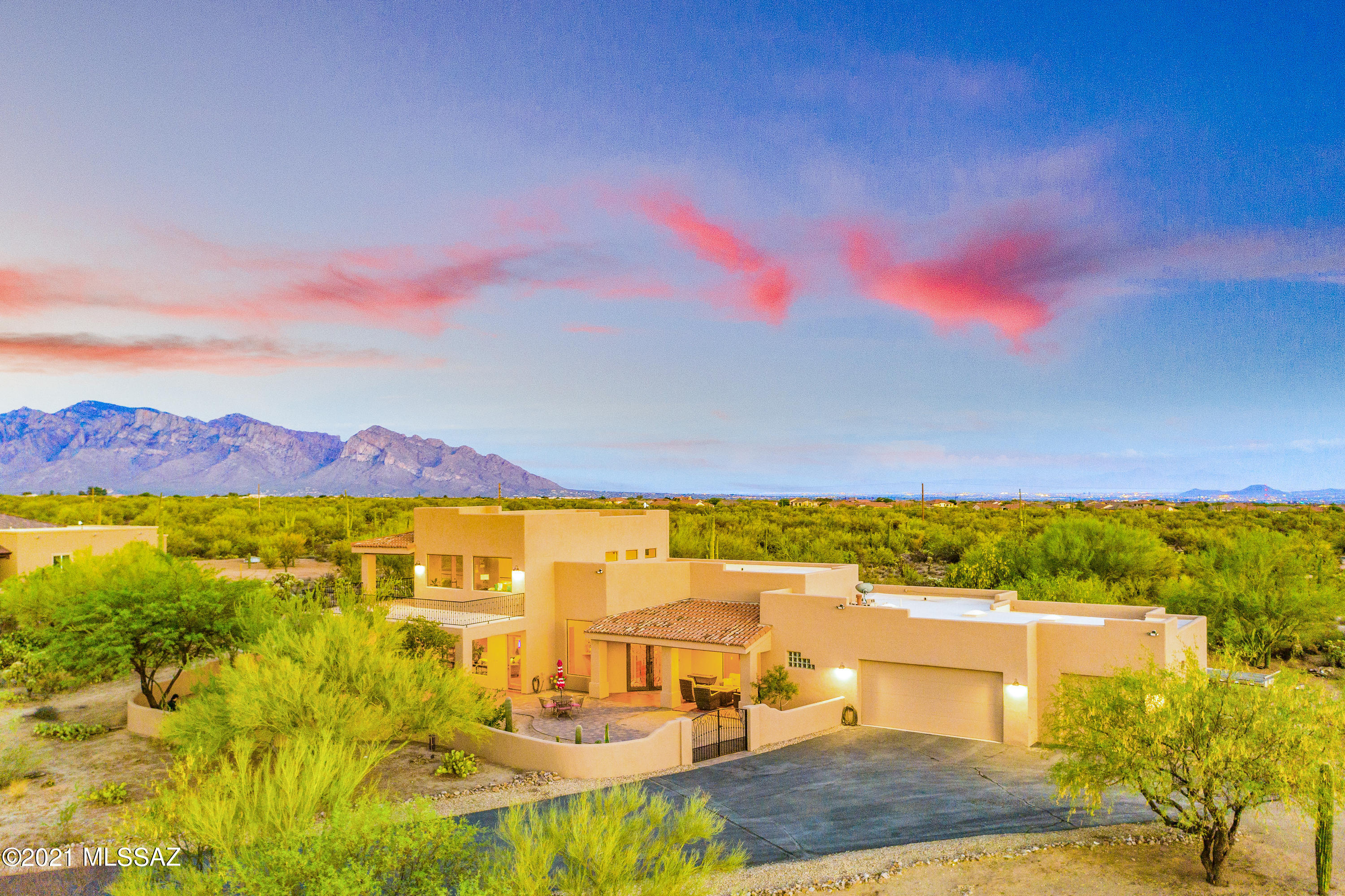 Tortolita Mountain Dream! Stunning home at the end of a cul-de-sac providing ample privacy w/ SPECTACULAR sunrise/sunsets and breathtaking MOUNTAIN VIEWS of the Tortolitas and Pusch Ridge/Catalinas. 4,054sqft of abundant living space is amazingly paired with a 1,304sqft 3-car premium epoxied garage. An additional 1,318sqft covered patio and deck provide the ideal space for ALL of your entertaining needs and desires! Perfectly situated on 4.26 acres with soaring ceilings, the perfect amount of dual pane windows capturing the amazing Southwest sunshine, full LED lighting, smart technology throughout, BRAND NEW exterior paint, NEW paved road July 12th in addition to your very own private road for dual access, and SO MANY MORE UPGRADES that the list goes on! Welcome to Your Desert Dream!