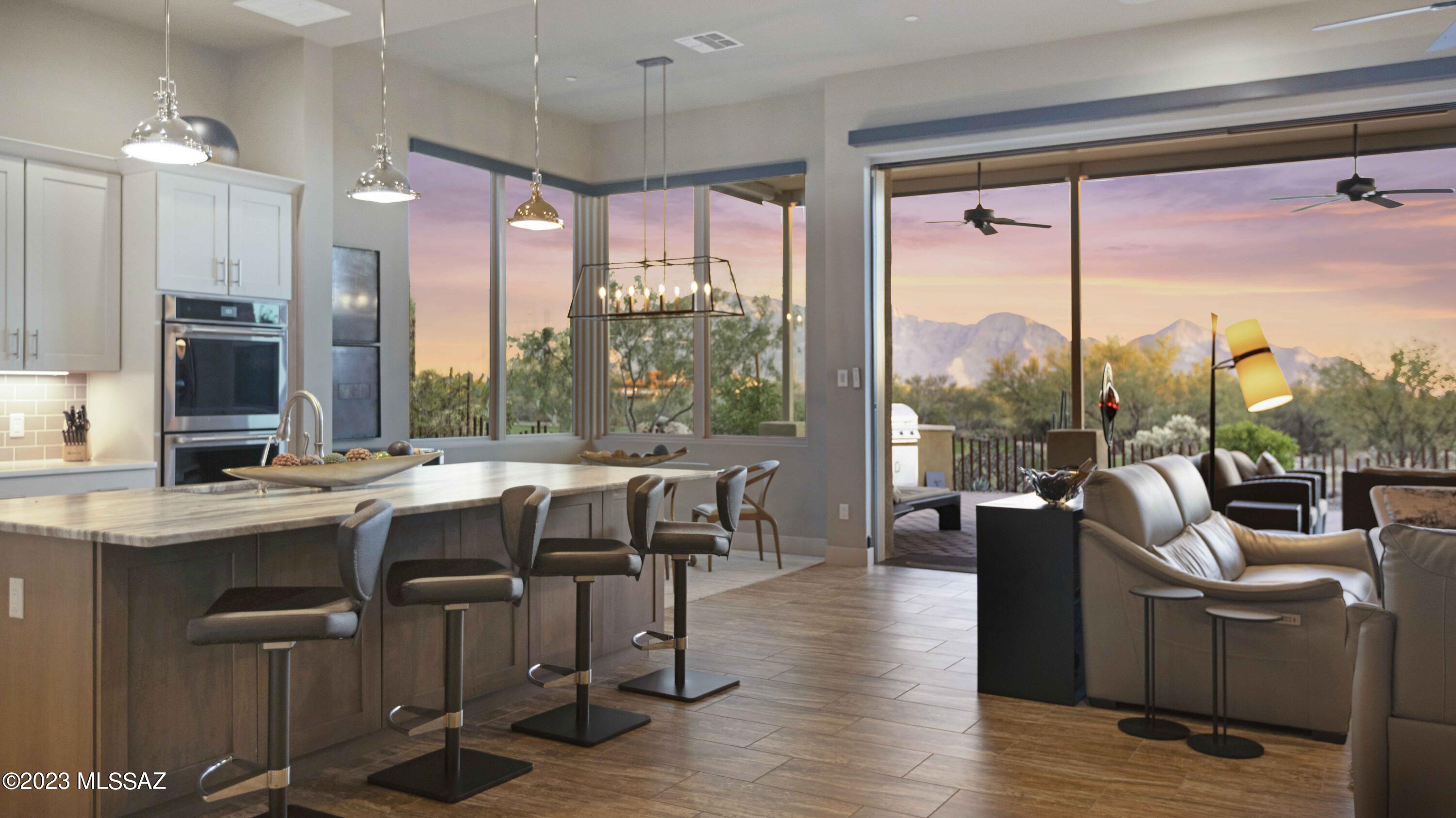 Discover the epitome of luxury living in this exclusive Enclave residence, located in the prestigious community of Stone Canyon. This opulent property graces a premium corner lot, commanding breathtaking views of the Catalina Mtns and the picturesque golf course.  The seamless blend of indoor and outdoor living is facilitated by 10ft electric sliding glass doors, offering a vista of natural beauty.
Inside sophistication reigns with high-end appliances, tile flooring and soaring ceilings, creating an ambiance of refined elegance.  The tandem 3-car garage ensures ample space for your vehicles and storage. The thoughtfully designed split floor plan encompasses 3 spacious bedrooms and 2.5 bathrooms, providing privacy and comfort.
Stone Canyon, renowned for its exclusivity, boasts a Jay-Morrish designed championship golf course and a state-of-the-art Health & Fitness club.  Indulge in exercise classes, spa services, and unwind in the lap pool, hot tub, or steam room.  Enjoy recreational activities like Pickleball and tennis within the community.
While residing in this haven, you'll feel miles away from the hustle and bustle, yet you're just minutes from all of the amenities Oro Valley and Tucson have to offer.  Explore hiking, biking and walking trails, relish dining experiences, indulge in shopping and have easy access to hospitals and more.  Elevate your lifestyle in this oasis of luxury and convenience.