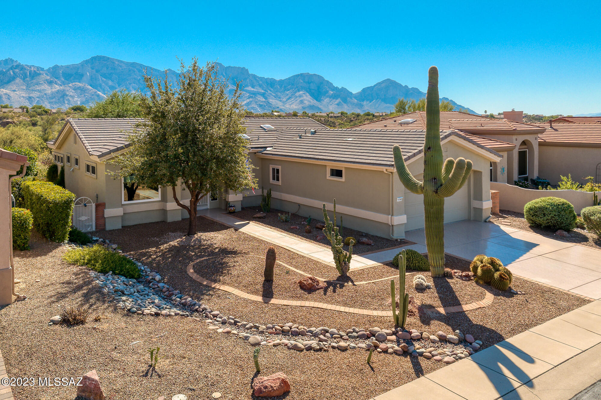 Incredible views from this renovated 2 bed, 2 bath plus den (1635 SqFt), Mayfair Model home located in Sun City Oro Valley. As you step inside, you'll immediately be greeted with large view windows showcasing the breathtaking Catalina Mountains. The kitchen is complete with stainless steel appliances, granite countertops, a breakfast bar and an open dining room. Indoor laundry room has ample storage and utility sink. Some of the newer additions include tile flooring throughout the main living area, carpet in bedrooms, HVAC, windows & replaced roof. The true showstopper of this home is the panoramic Catalina Mountain views, visible from both inside the home and from the backyard.  Sun City Active Adult Community features a clubhouse, golf, fitness center, pool, library & more!