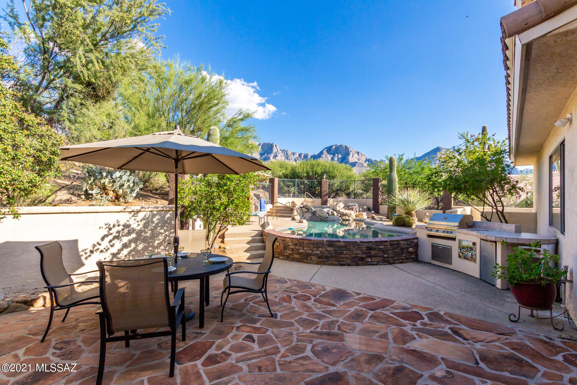 Stunning home with breathtaking mountain views! Offering spacious 3-car garage, professionally landscaped backyard, captivating interior w/designer palette, stylish light fixtures, travertine floors, high ceilings & internal wired internet network. Cozy-up by the fireplace in the family room w/patio access. Amazing gourmet kitchen features granite counters, mosaic backsplash, wood cabinets, wall oven, walk-in pantry & center island. Bright breakfast nook w/bay window overlooks the mountains! Main suite boasts private sitting area, full ensuite w/dual vanities, jetted tub, and his & her walk-in closets. Enjoy the resort-style backyard w/covered patio, built-in BBQ, & sparkling pool w/spa!
