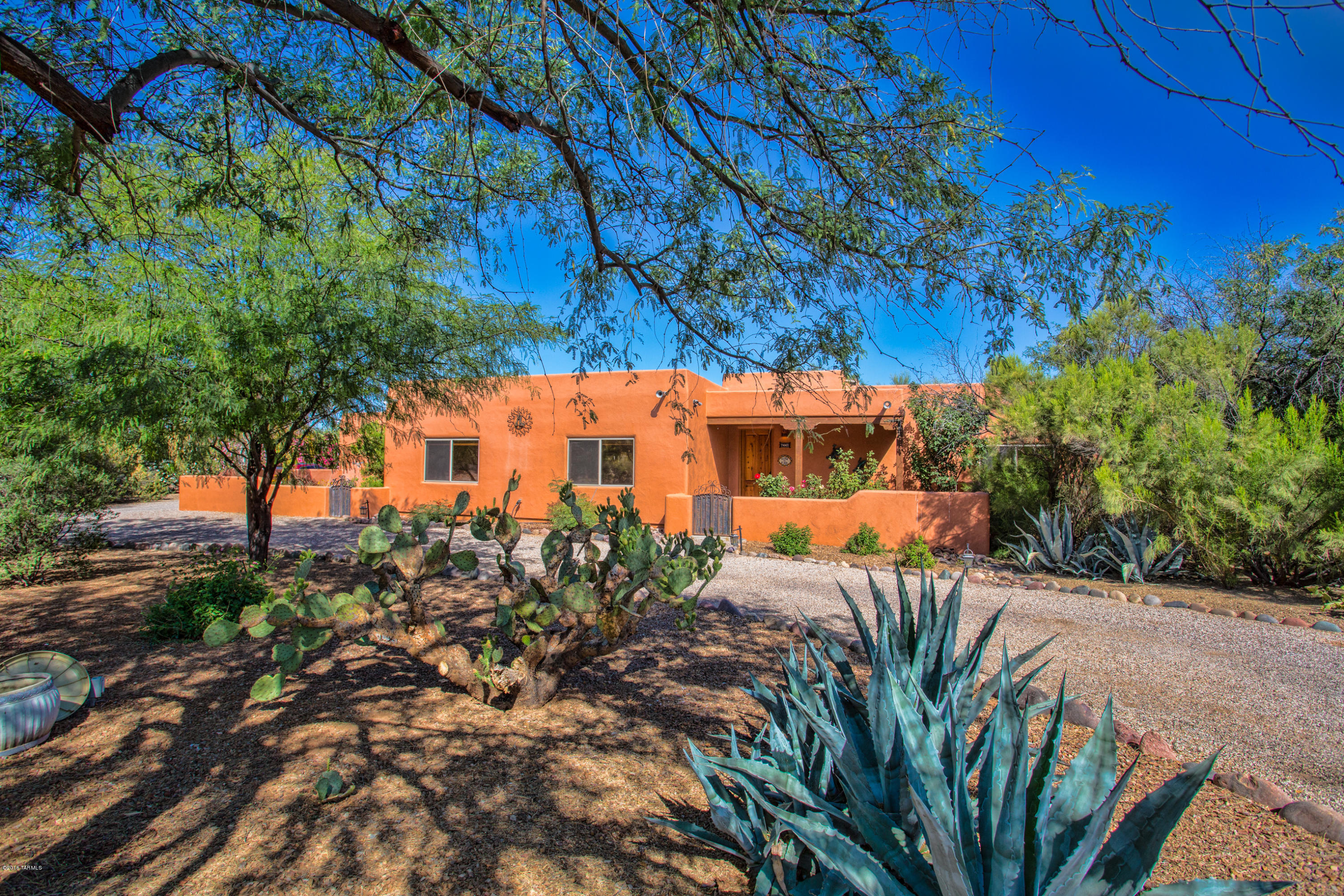 Awesome custom built Santa Fe style home on completely usable .8 acre lot. High ceilings throughout and a gorgeous view from every window. Great Room plan with huge resort style fully walled-in backyard. Beautiful sparkling pool, outdoor kitchen and fire pit. Interior has a gourmet kitchen with upgraded appliances including a gas cooktop, built-in oven/convection oven, custom cabinets and granite countertops and breakfast bar. Owner's suite has his and her's closets, a soak tub, oversized custom shower & a seperate office or exercise room with beautiful views. The other 3 bedrooms are spacious, in a separate wing of the home, and share a large bathroom with double sinks. The 3 car garage provides plenty of room for a workshop or room to store ''toys''.  AMBIANCE, CHARM & PRICED TO SELL!!