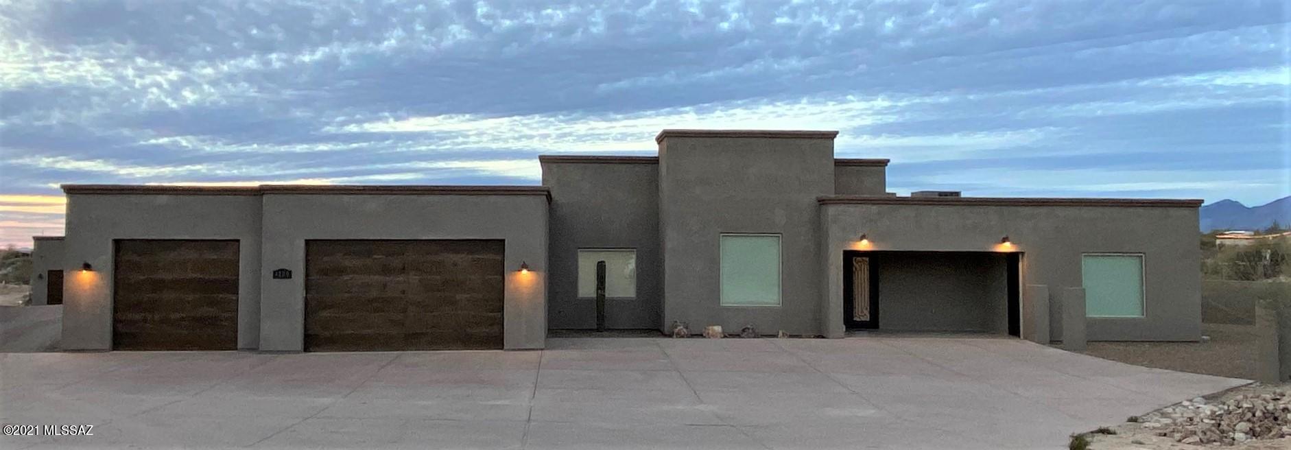 Beautiful contemporary custom Estate on 3.3 Acre lot with exceptional views! Main House 4,175 sq/ft. 4BR/4BA, Guest House 3,000 sq/ft. 1BR/2BA. Custom touches throughout both homes! Dramatic 17 foot ceilings and natural light. Master suite boasts custom closet with storage, vanity and chandelier. Enjoy the master bathroom rain shower, jetted tub and gorgeous lighting. Flex room/Game room has back patio access, wet bar and full bath. Don't miss the DREAM GUEST HOUSE with over 3,000 sq.ft. of contemporary tiling throughout, large barn doors, fully equipped in home JBL Audio stereo system, IR/Night Vision cameras and the only home in community with FIBER internet. The sky is the limit with the guest home and or/STUDIO/OFFICE. NO HOA! RV parking allowed. Located in quiet cul-de-sac!