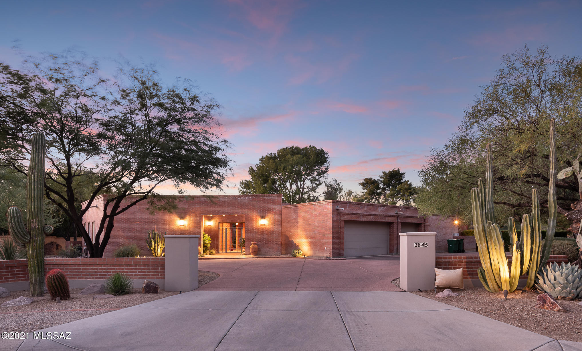 Tucson Country Club 10th fairway golf course lot, with beautiful views of the Catalina mountains. The courtyard entry leads you to the lovely main residence with 4 bedrooms and 3 and a half baths. Beautiful formal living and dining rooms with lots of windows looking onto the rear yard and greens, with a lovely den space adjacent. Bright and open kitchen has a dining area and is open to a pretty ''garden'' room. There are 3 well-sized guest bedrooms, one a large en-suite with a separate entry.  The spacious master suite features ample walk-in closet space and a generous master bath retreat with dual vanities and showers and a serene spa bath. There is also a large gym area near the 3 car garage. Across the courtyard is an extensive guesthouse (over 1700 sqft) currently used as a library.... Major additions and renovations have been made over the years (with permits), ask agent for details.