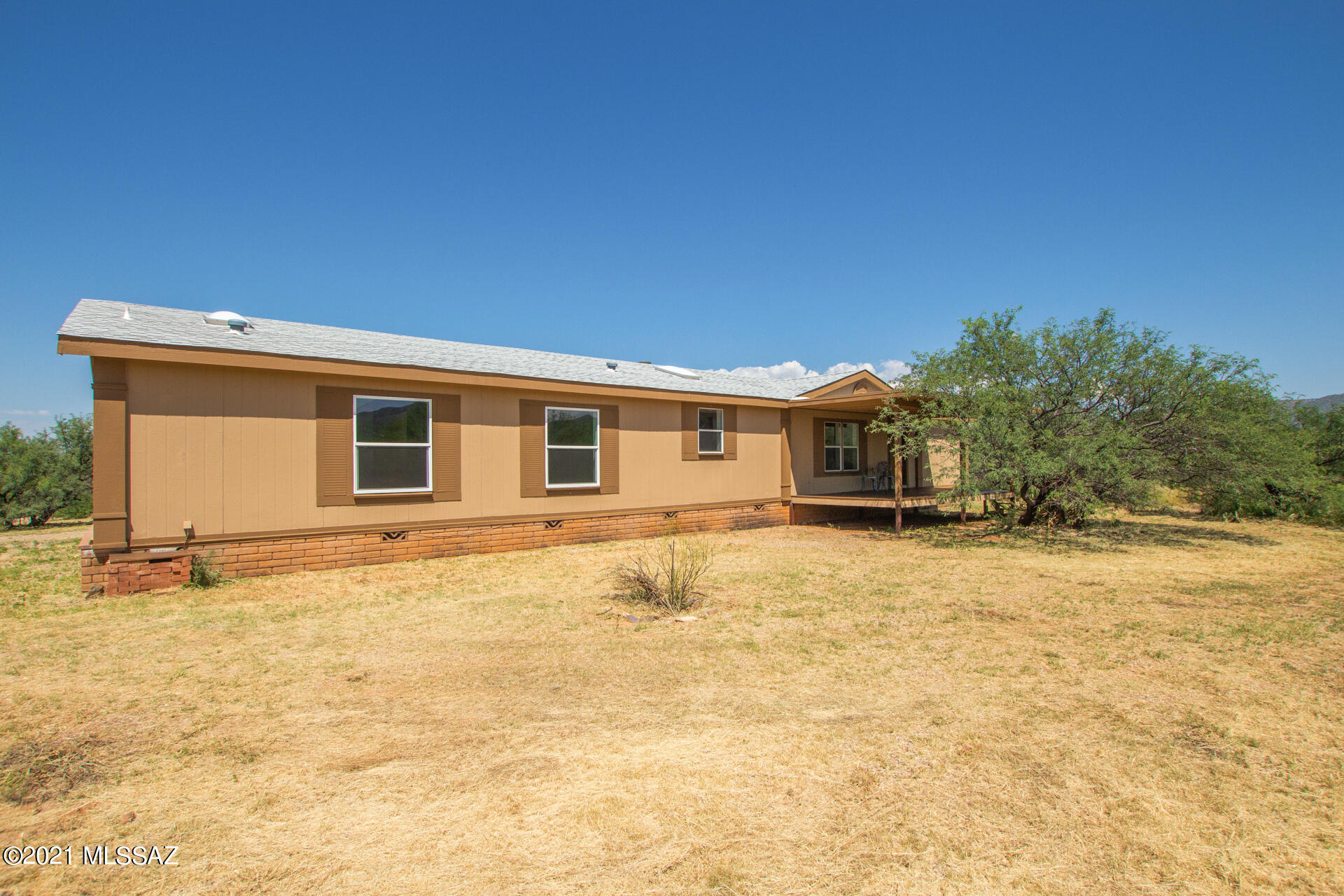 4 Acres of Horse Property and Views, Views, Views! Cozy front porch perfect to enjoy your morning coffee. Discover a bright interior with an inviting two-way fireplace, vaulted ceilings, tile floors w/carpet in all the right places, & soothing palette. If entertaining is on your mind, you'll love this open layout! Enjoy cooking in this beautiful kitchen with stylish gray cabinets, skylight, & center island w/breakfast bar. Spacious main bedroom includes a mirror closet & private bathroom w/two vanities & soaking tub. Enjoy the wonderful natural mountain landscape and beautiful views from the relaxing deck. Lots of privacy and expansive lot for you to make your own. Call to schedule your showing today!