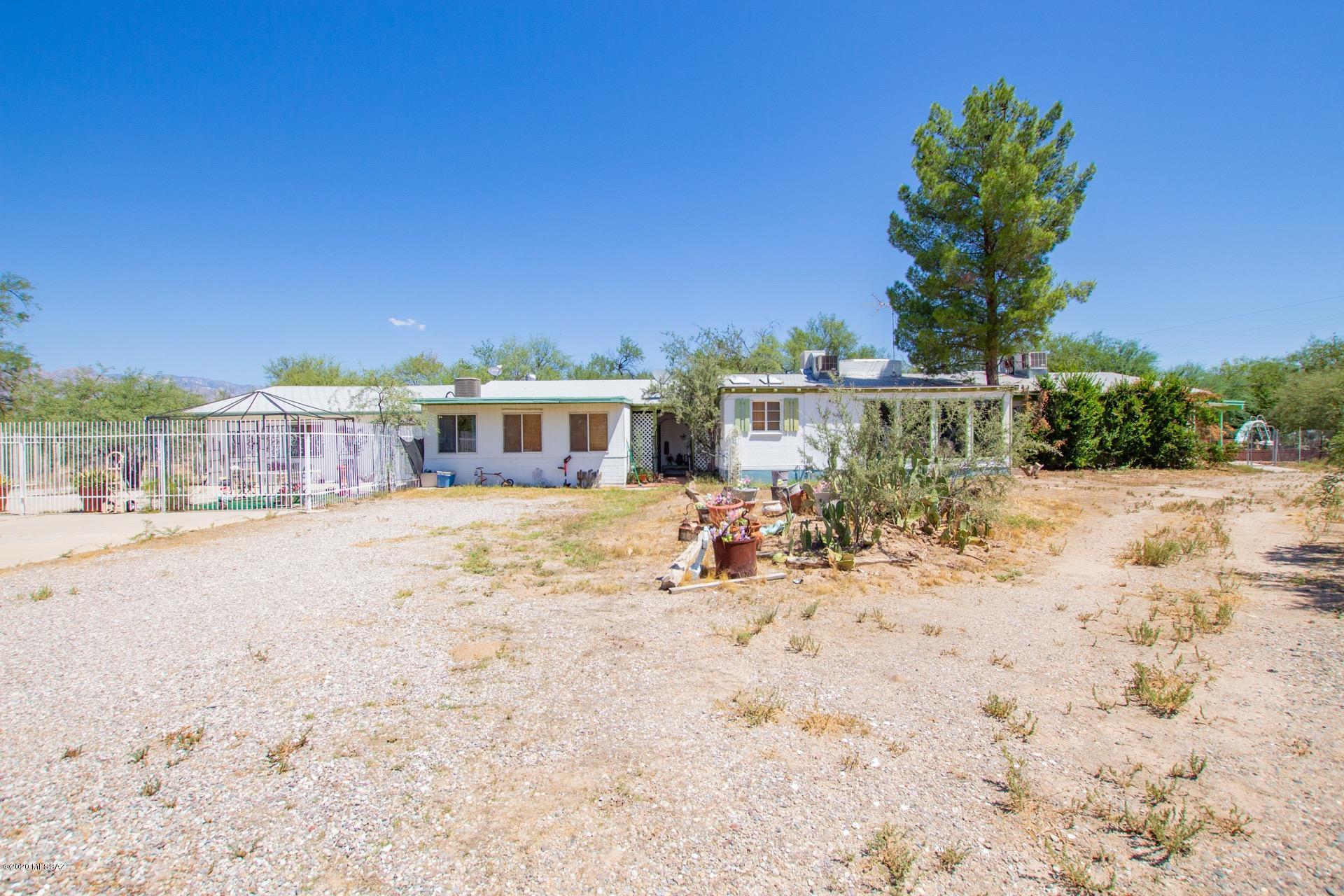 Fantastic Home & Guest House situated on over 9 acres w/Mountain & desert views. Property currently being used as an assisted living facility. Sparkling fenced diving pool, covered patio, shade trees, & vast blue skies. Vaulted wood ceilings, soothing palette, plush carpet, ceiling fans, lots of natural light throughout, fireplace, attached atrium, & formal dining area w/wood ''look'' tiled floors. Breakfast bar, granite counters, skylight, & plenty of wood cabinets. Spacious family room for entertaining.  vaulted wood ceiling in master retreat, private en suite w/dual sinks, & jetted tub. Charming guest house, full kitchen, French doors, ceiling fans, tiled floors, & 1 bath. Plenty of space for all your toys. Take a look at this incredible Investment Opportunity!