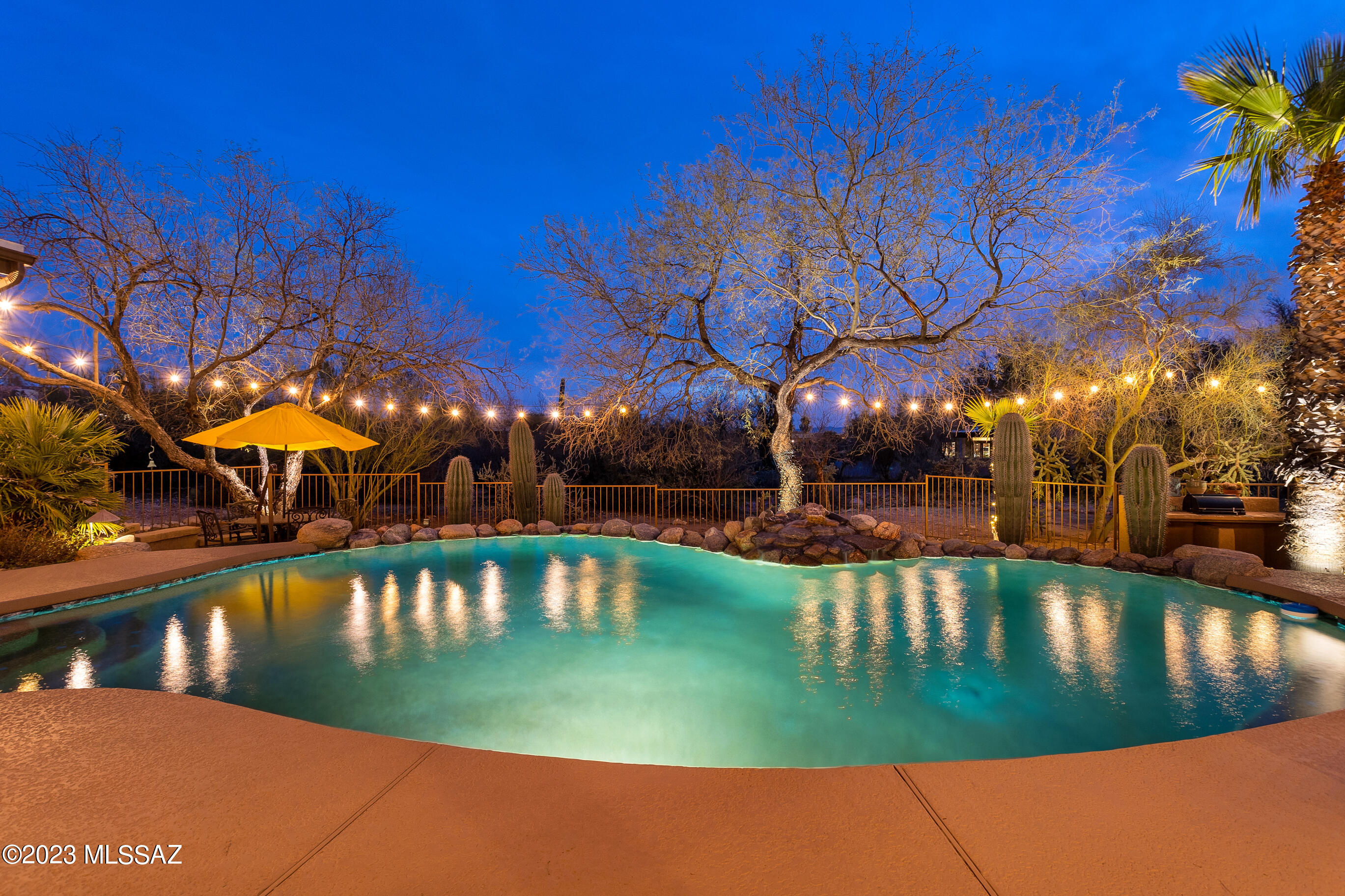 Set on one of the very best lots at the end of a quiet cul-de-sac in popular Shadow Hills. Situated on nearly an acre. This original owner's home has been meticulously maintained and lovingly cared for. The bright and warm front entry welcomes you from the moment you arrive. The open kitchen features double Thermador ovens, a cozy breakfast nook, plenty of pantry storage, and views of the amazing backyard and pool. Picturesque windows capture mountain views from the front living room. The dining room is perfect for entertaining. The fourth bedroom is a great office option. The rear yard is spectacular - lush & green w/mature vegetation and backs up to private natural desert. Some of the many updates include: Pebble Tec pool finish, exterior home painted, custom brick paver driveway. The roof was fully replaced in 2014 and has a 1 year transferrable warranty available.