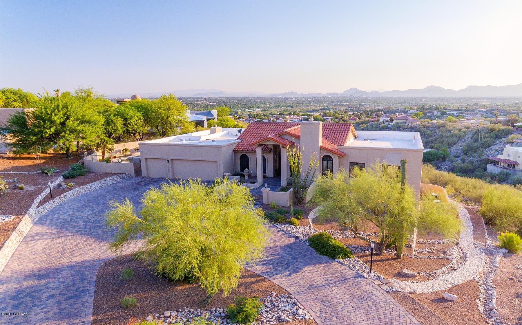 Price range-Seller will accept or counter offers between $850,000-$875,000!  Private 5 BRS/3.5BA luxury home situated on 2  cul-de-sac overlooking several mtn ranges & 180 degree city views! Interior has been stunningly updated! Granite kitchen w/high end cabinets & Thermador appliances, open to family (great) rm & breakfast nook! Master w/designer bath! Beautiful floors-porcelain tile & acacia wood! Home theater w/surround sound & wet bar! Guest ste, over-sized office/game/gym rm! Separate entrance too! BONUS-Large heated & cooled workshop/hobby rm & 20 x 20 indoor storage rm! Spectacular entertaining w/800 ft of balconies & remodeled pool-all surrounded w/spellbinding views inside & out! 3 car gar! prestigious lifestyle near restaurants, shopping, Basis school & the famous River Walk!