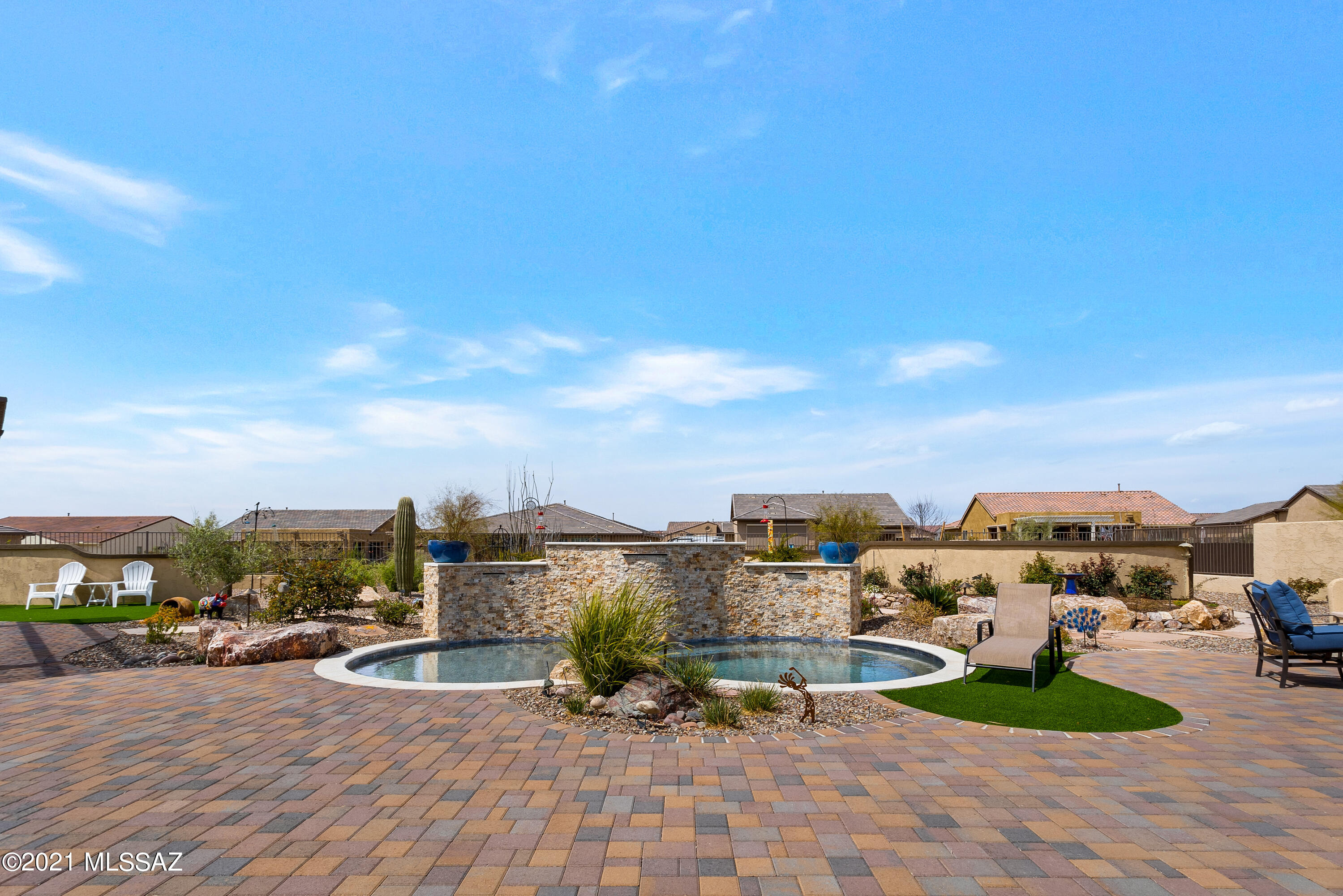 This popular Tesoro model in SaddleBrooke Ranch is ready for you! No need to wait for a year or more to build. This Home is was completed in 2018 and no expense was spared in it's Design. Situated on a quiet cul de sac lane, backs to a small arroyo giving you space in the back. The lot is nearly a 1/3 acre and the landscaping is amazing. A beautiful, heated Spool, built in BBQ with Pergola and great mountain views, Built in gas firepit with built in seating and lovely flowers, landscape design and WIFI Booster installed in backyard. Is an entertainers delight! Inside, upgraded appliances, flooring, counter tops, closet built-ins and Lots of Cabinets for storage. Expanded 3 car garage with built-in cabinets.  Whole home security features monitoring cameras and remote access.  Plus More!