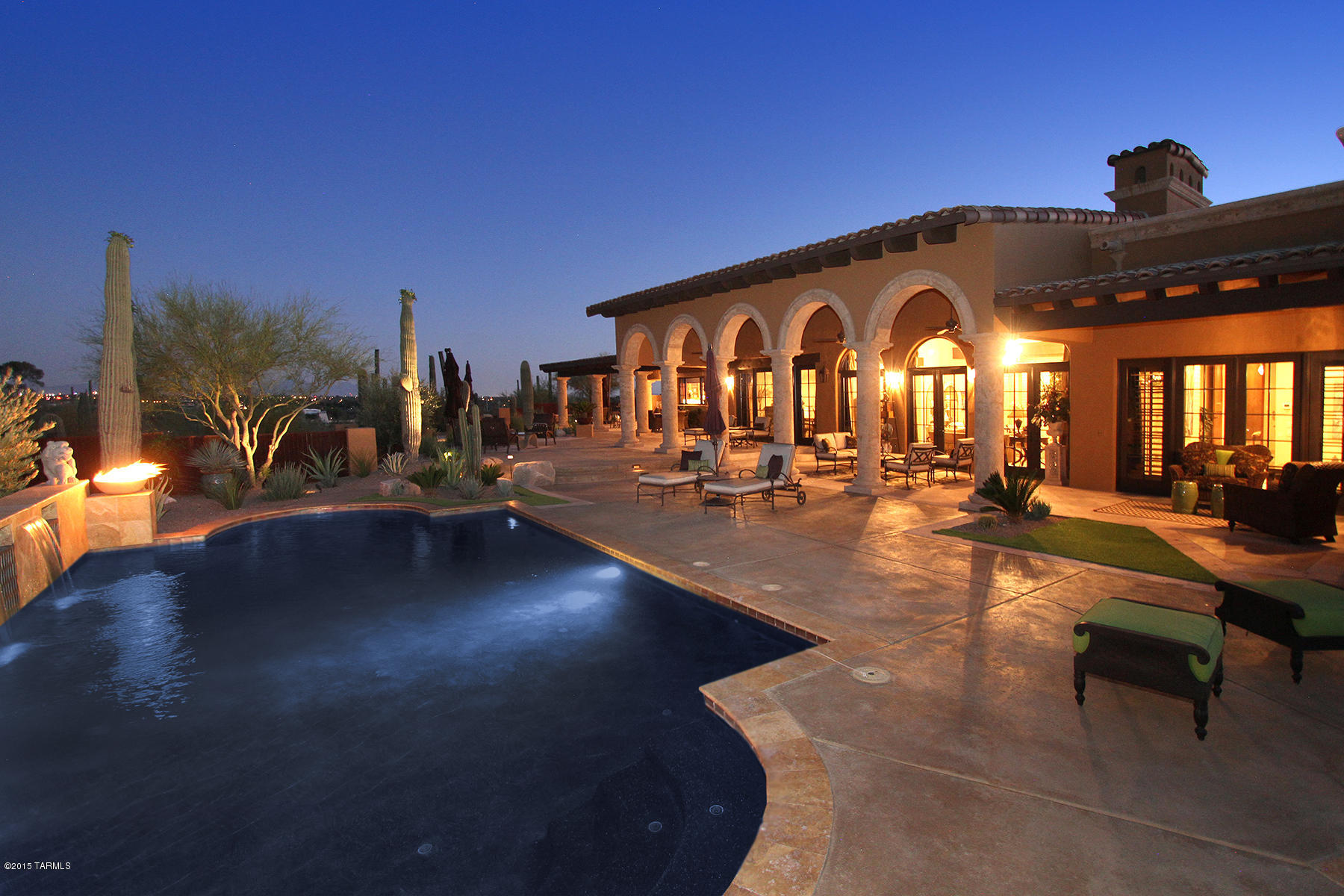 Experience all the grandeur of this magnificent 2008 custom built Mediterranean w/private brick paver driveway leading to courtyard w/fountain. Nestled on two lushly landscaped hillside acres boasts Colletti metal entrance door to foyer,cantera & wood floors, hand etched glass & chef's kitchen w/walnut cabinets,stone sinks,granite, Mielo, Subzero and Dacor appl. Butler's pantry w/100 bottle wine refrigerator conveniently located off kitchen & DR. Sumptuous master suite w/rotunda ceiling & sitting area leads to master bath featuring dual stone vessel sinks and soaking tub overlooking private courtyard w/fountain. FR & LR feature dramatic wood beam ceilings, stone carved FP & cantera columns.Outdoor oasis with pool/spa, firepit, sitting area & kitchen provide the perfect place to entertain.