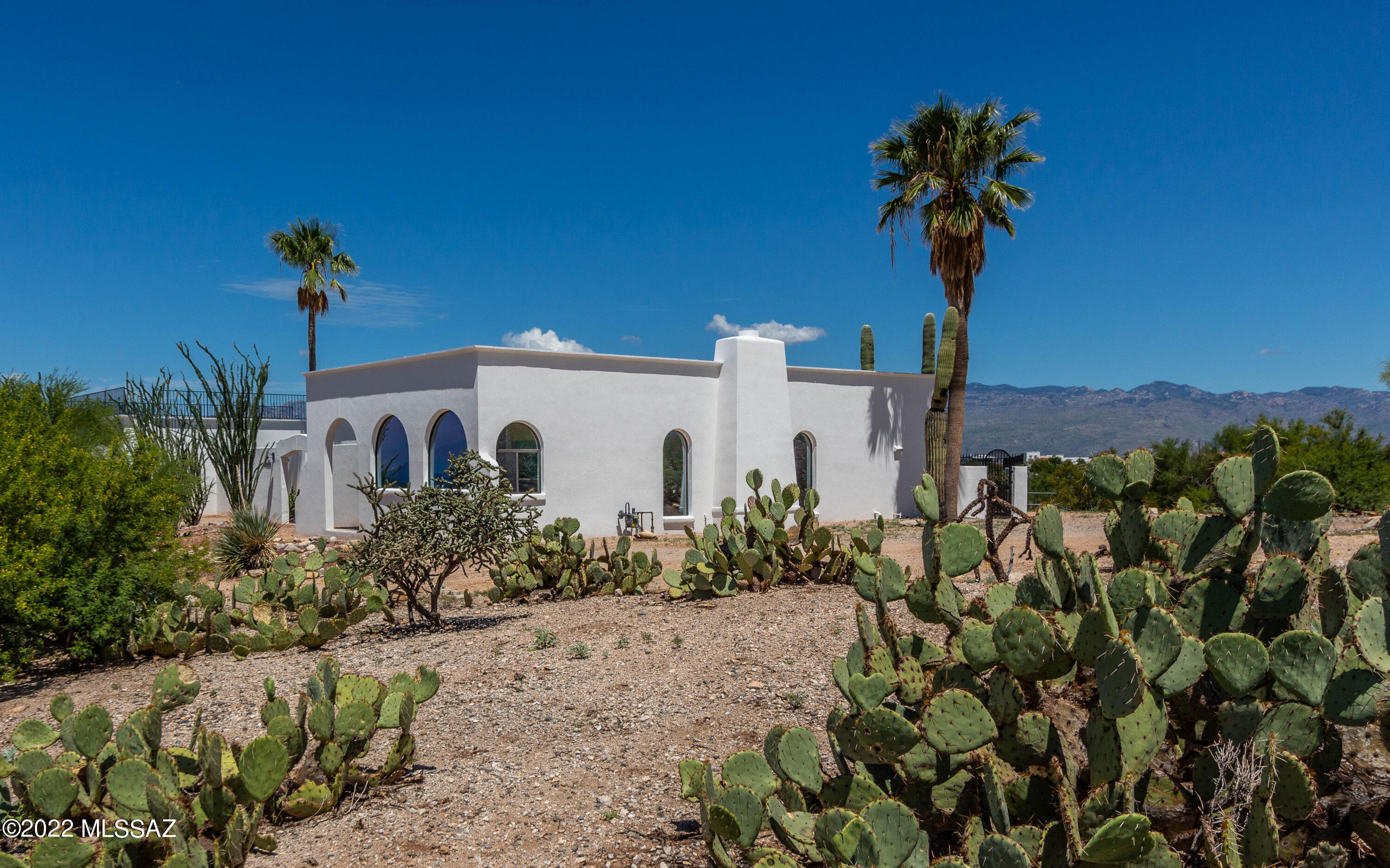 Welcome to Two Bird Ranch. The property consists of 5 bedrooms in the main home + a spacious guest house (built in 2014). Character abounds with wood beams, Mexican tile accents, and one-of-a-kind vanities. Fun fact: this home was previously owned by Muriel Shandling (mother of comedian Garry Shandling). The backyard has a heated pool/spa and a full-length covered patio with great views of the Rincon and Catalina Mountains. New improvements include new synthetic stucco, new roof on main house, new SS appliances, fresh paint in and out, and more (see full list). Horses are welcome (current owners don't use the existing corral) and bring your RV (full hook-up). Don't miss the roof-top deck, a great place to stargaze. Close to Saguaro Natl Park E, shopping, and the new Northwest Hospital.