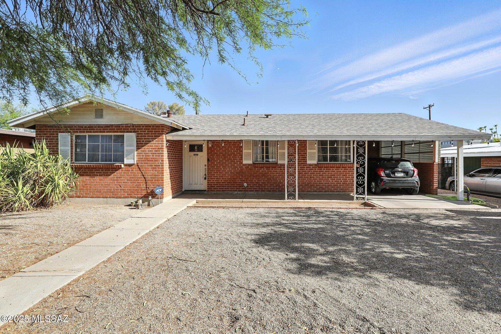 Beautifully updated 3-bedroom, 2-bath home located in a quiet and established central Tucson neighborhood. Recent upgrades completed in 2024 include new flooring throughout, a fully remodeled kitchen, and a stylishly renovated main bathroom. The roof was also replaced in 2024, offering added value and peace of mind. The spacious backyard is a blank slate, ready for your personal touch—perfect for gardening, entertaining, or creating your own outdoor retreat. This move-in ready home combines modern updates with classic charm in a desirable location.