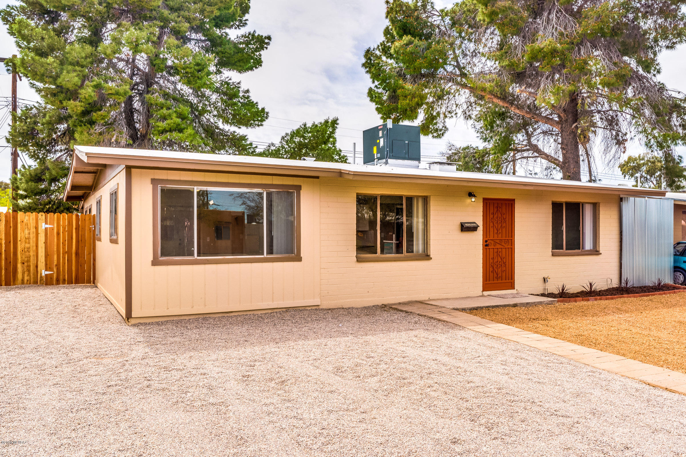 Welcome home! The minute you walk in you will fall in love with this remodeled home. New roof, new AC, Concrete floors, open floor plan with huge island/breakfast bar and an all new contemporary kitchen. This 1961 home is better than new and shouts perfection and attention to detail inside and out. All you need to do is back up the moving truck and start living.  Centrally located near Randolph Park and a short commute to downtown and U of A. Fresh paint and new carpet in all bedrooms. Also, a large storage shed and spacious backyard. Seller is a licensed real estate agent in AZ.