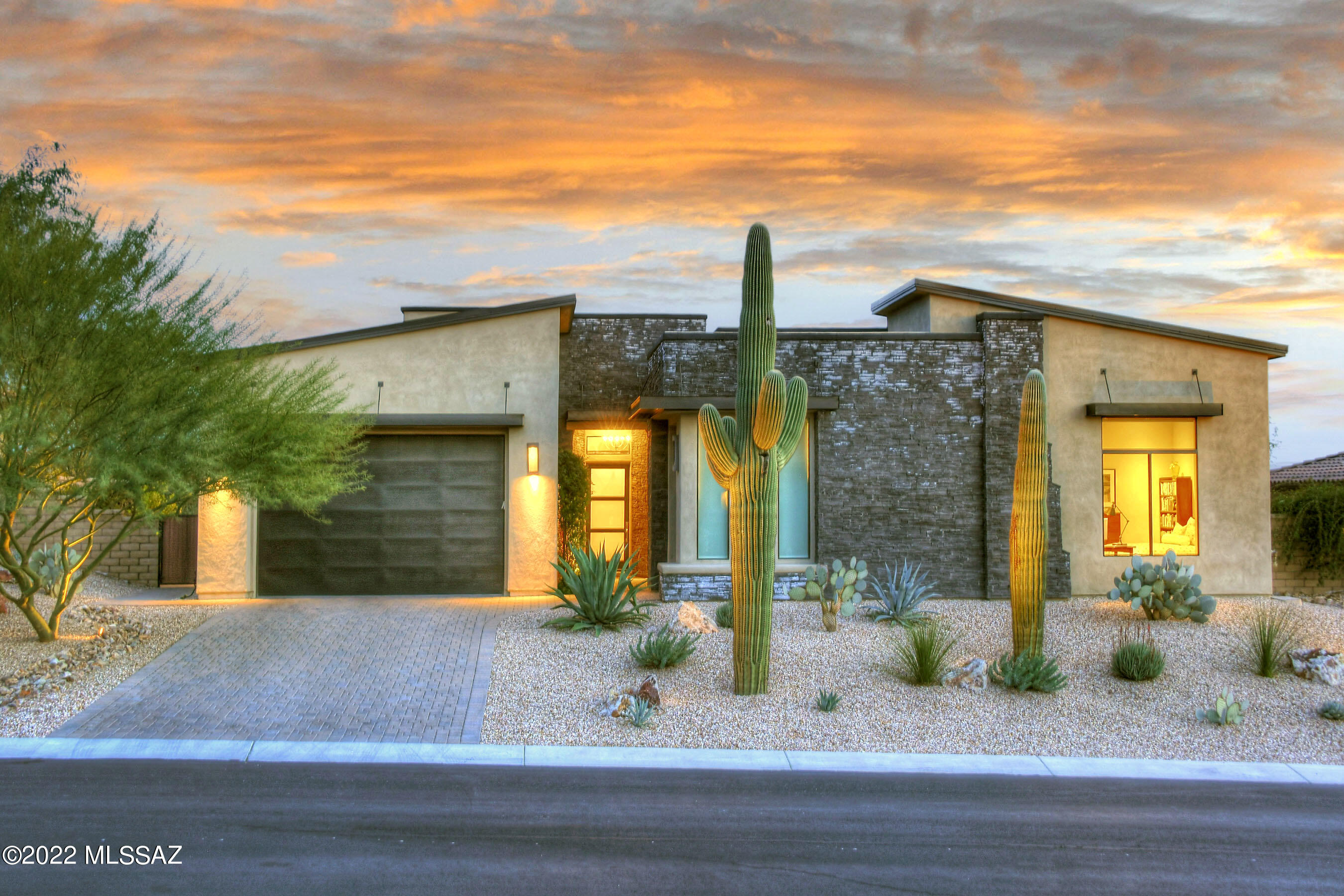 * MODERN ELEGANCE* STUNNING TOLL BROS ESTATE NESTLED IN THE LUXURY ENCLAVE  OF LOS SAGUAROS@DOVE MTN! EXCELLENT CRAFTMENSHIP & TASTEFUL SELECTIONS CREATE A SERENE & RELAXING ENVIRONMENT! WONDERFUL RETREAT BOASTS- CONTEMP LINES + ORGANIC DESERT TEXTURES & TONES!
SPLIT BR FLRPLN OFFERS ''12 FT'' CEILINGS THRU-OUT, HUGE GATHERING RM- HUB OF THE HOME...TONS OF GLASS BRINGS THE OUTDOORS IN! INCREDIBLE  CHEFS KIT- CUSTOM DESIGNED *EXT'D HEIGHT* MAPLE CABINTRY/GLASS ACCENT CABS, UNIQUE BLK SS ''PROFESSIONAL SERIES'' APPLIC, OVERSIZED ISLAND-BKFAST BAR, QUARTZ/ GRANITE CTRS/GLASS BKSPLASH! CASUAL DINING LOOKS TO MTN RANGES & ZEN GARDEN, SOOTHING WTRFALL, ALFRESCO KIT/BBQ!  *BONUS RMS* DEN + REC RM W/CUSTOM BUILT INS + EXTRA 225 SQ FT OF LIVING SPACE''- 3RD CAR HEATED/COOLED PERFECT GYM- WORKSHOP!