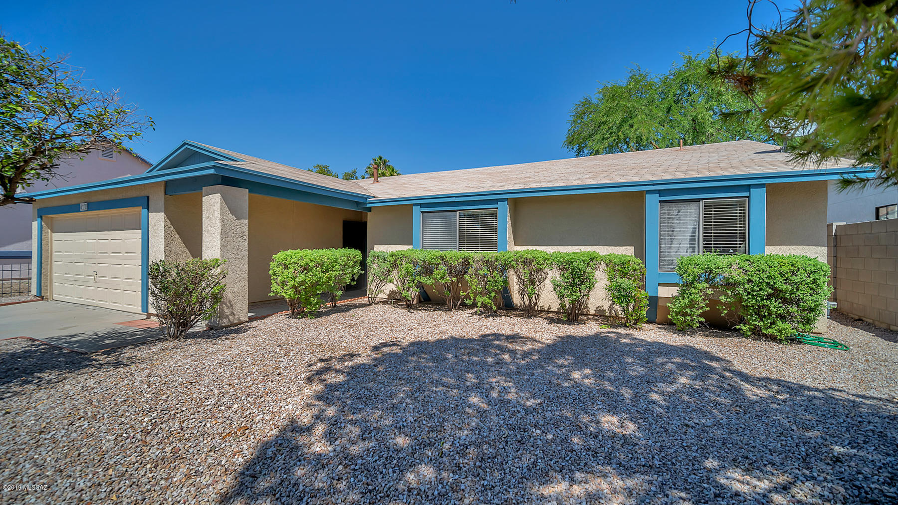 Ready to move in now! Excellent split floorplan, new carpet, new paint, new dishwasher, new roof shingles on north side, new light fixtures, new window coverings. Garage has plenty of storage and walled in backyard with a beautiful tree.  Very quiet neighborhood and right across the street from Crooked Tree golf course. This home will not last long, ACT NOW.