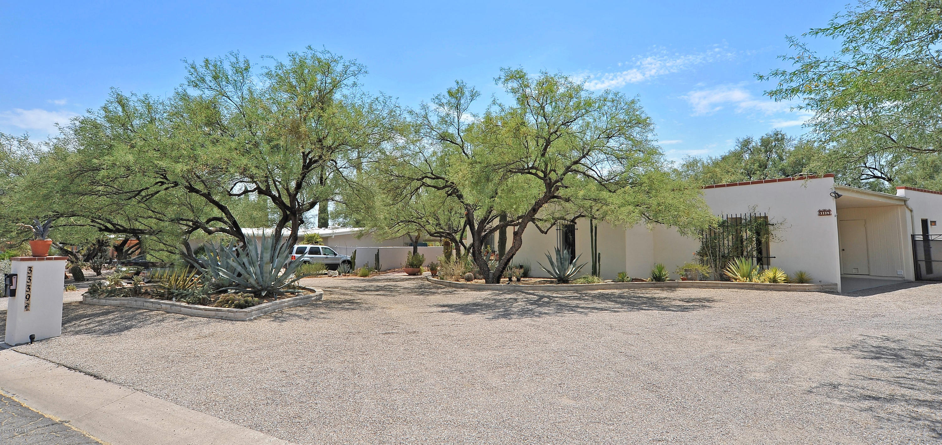 Sellers will accept or counter offers $295,000-$310,000 on this beautifully appointed stucco over masonry split plan 4 bedroom 2 ½ bath in coveted Sabino Vista! Dramatic front atrium w/ water feature, granite & stainless steel kitch, mirrored formal dining room, family room w/fireplace, recently renovated hall & master baths! 64 X10 enclosed Arizona room runs the full length of the house & looks out onto a rare double walled secluded backyard oasis boasting expansive masonry patio, night lighting, fig, grapefruit, lime & grape vines as well as several varieties of colorful plants, trees & cactus!  New master bedrm carpet & freshly painted interior! Epoxy painted dbl carport w/built-ins + storage/shop. Central vac. Walk to award winning Fruchtendler Elementary.