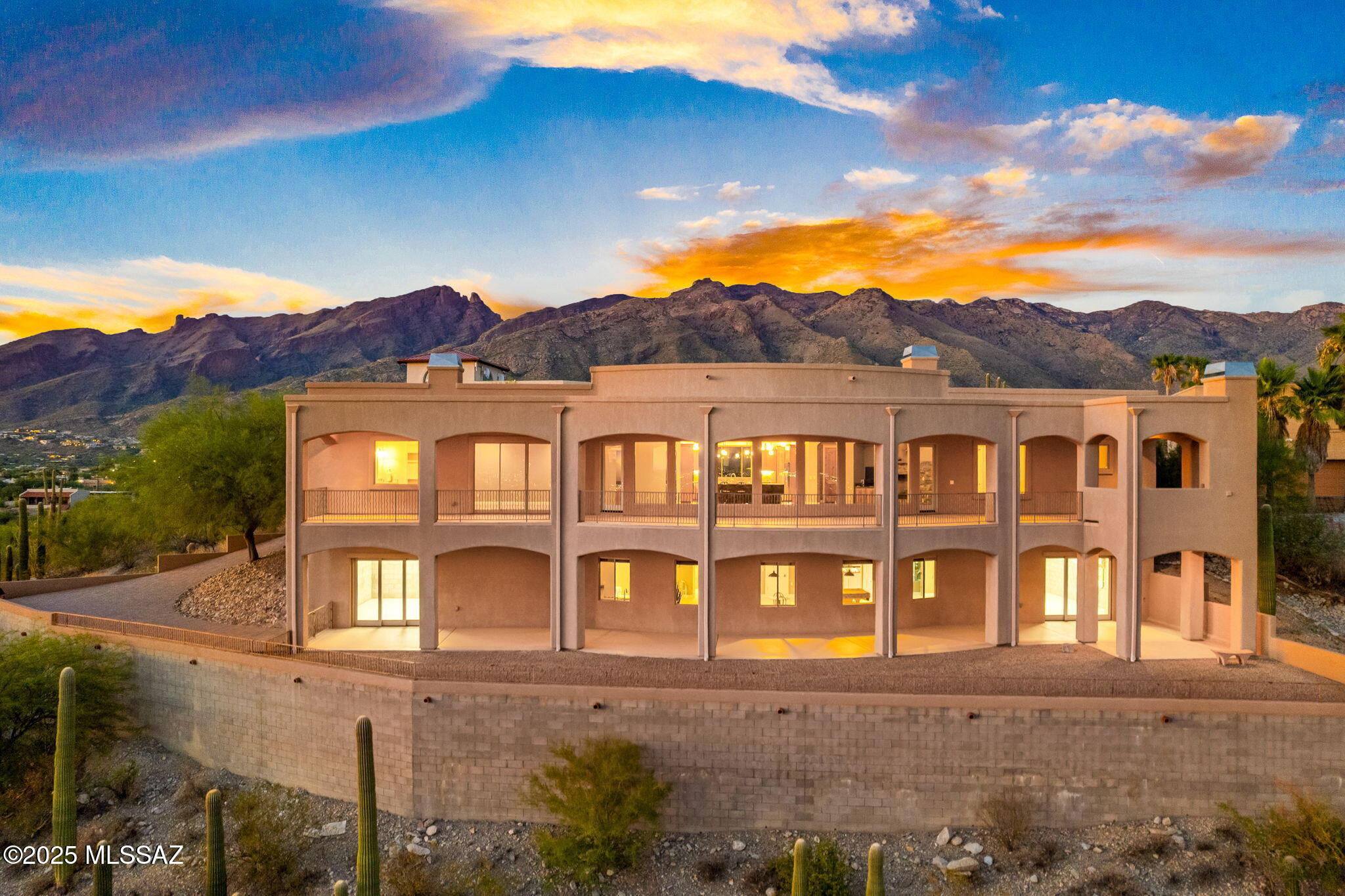 Perched high with breathtaking, unobstructed city views, this one-of-a-kind residence offers nearly 6,000 sq. ft. of heated and cooled living space, including more than 3,000 sq. ft. above grade plus a fully finished basement with a second kitchen and full bath. Designed with exceptional construction quality and detail, the home provides flexibility for multi-generational living, entertainment, or expansion. The main level features a chef's kitchen with Frigidaire Pro Series appliances, granite countertops, soft-close cabinetry, a pop-up vented cooktop, walk-in pantry with space for an additional refrigerator, and a small wet bar with RO water. The owner's suite includes a jacuzzi tub and spacious walk-in closet, while the full laundry room is complete with built-in ironing, folding, and hanging space. Custom millwork, all-ceramic tile flooring, central audio, and a central vacuum system further enhance the home.

An expansive 98.6 ft. covered patio and balcony span the back of the home, perfectly positioned for shade in summer and sun-warmed windows in winter, and is pre-plumbed for a future outdoor kitchen. The lower level offers a versatile retreat with a second full kitchen (minus oven), full bath, and large living area, with the option for the pool table and booths to remain. The 3-car garage includes a workshop space with coated flooring and compressed air plumbing, while a private drive shared with neighbors provides added security and seclusion. Additional opportunities include the potential for a pool and landscaping to further complement the panoramic views. With no need for curtains and vistas that stretch endlessly across the city, this property combines quality, scale, and lifestyle potential, complete with original build drawings and photos that document its thoughtful design and execution.