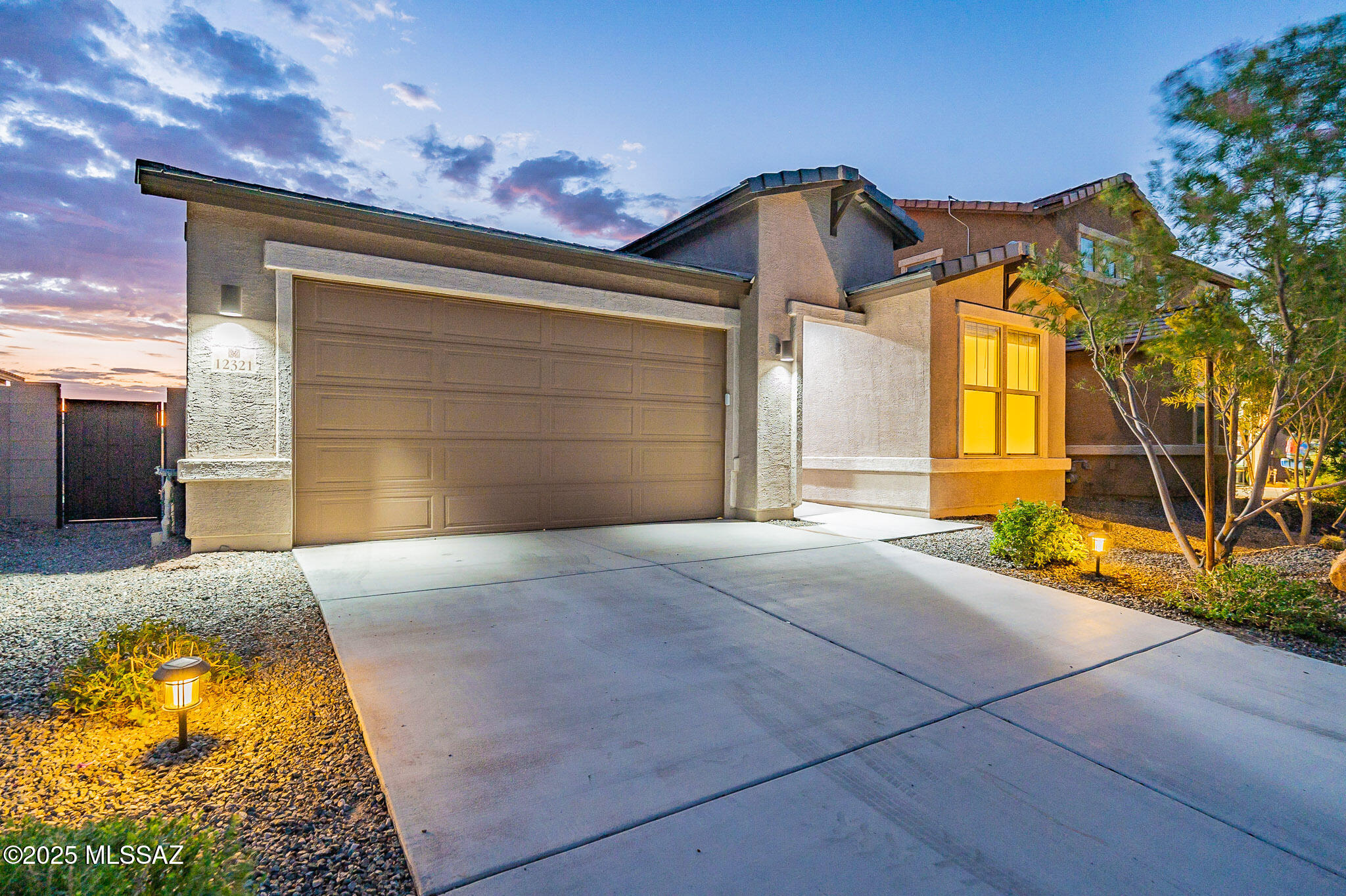 Why wait months for a new build and potentially pay $92,000 more for the same Sapphire floor plan without a finished backyard? This beautifully upgraded 4-bedroom, 3-bathroom home offers an incredible opportunity to assume an FHA loan, potentially adding even more savings. Upgrades include extended wood-look tile flooring, a modern kitchen backsplash, a farmhouse sink, a barn door in the primary suite, and extended patio doors for seamless indoor-outdoor living. A versatile additional living space near one of the bedrooms and bathrooms provides the perfect setup for guests, multi-generational living, a home office, movie room, or gym. The large, finished backyard is ready for your vision, with room for a pool, gardens, a dog run, fire pit, or your ultimate entertainment space. Located near multiple parks, trails, the Loop bike path, the new Fry's grocery store, dog parks, the new aquatic center, and exciting upcoming venues, this home offers both convenience and lifestyle. Don't miss out on this rare savings opportunityschedule a showing today!