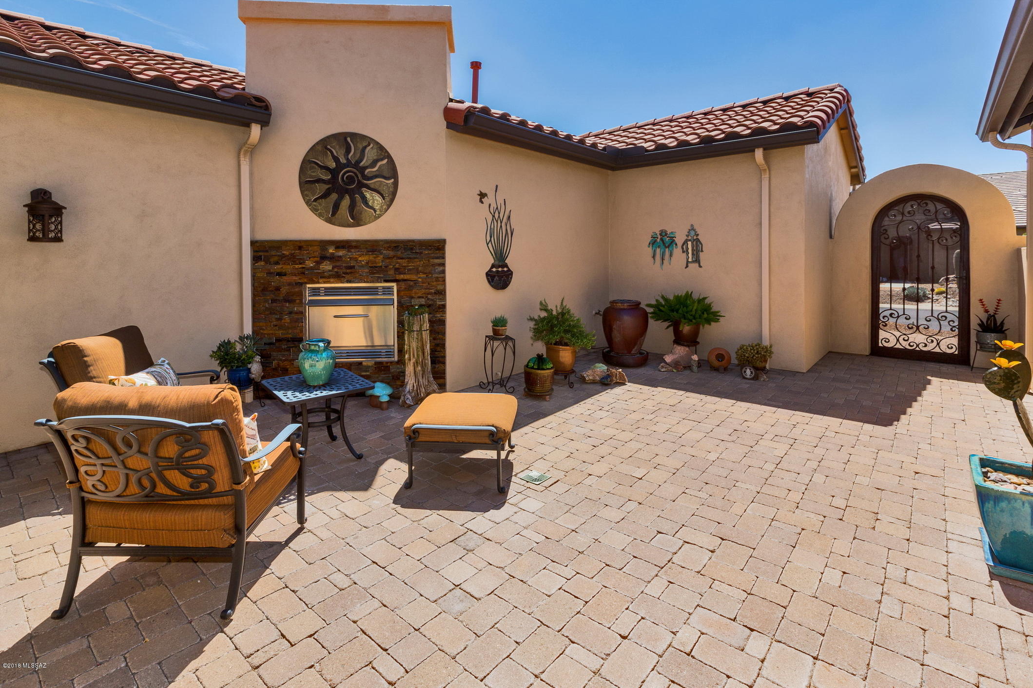 With informal elegance and comfort, this lovely Mirasol Model offers beautiful views of mountains, desert, and golf course.  Relax outdoors with friends on your spacious rear patio with a northern exposure that provides shade year round.  Entertain inside at the well appointed wet bar.  Enjoy the cozy gas fireplace in the privacy of your interior courtyard.  Elegant foyer features an impressive Tiffany style light and tile medallion in the floor.  Relaxing den features French doors to close in the space when needed.  *Granite kitchen Countertops* Elegant Kona Cabinets* Tile Backsplash* Stainless GE appliances* Built in Microwave and Oven* Ceiling fans* Bay window and door to rear patio in Master Bedroom* Quartz countertops in master and guest bath* Laundry room cabinets* All this and more.