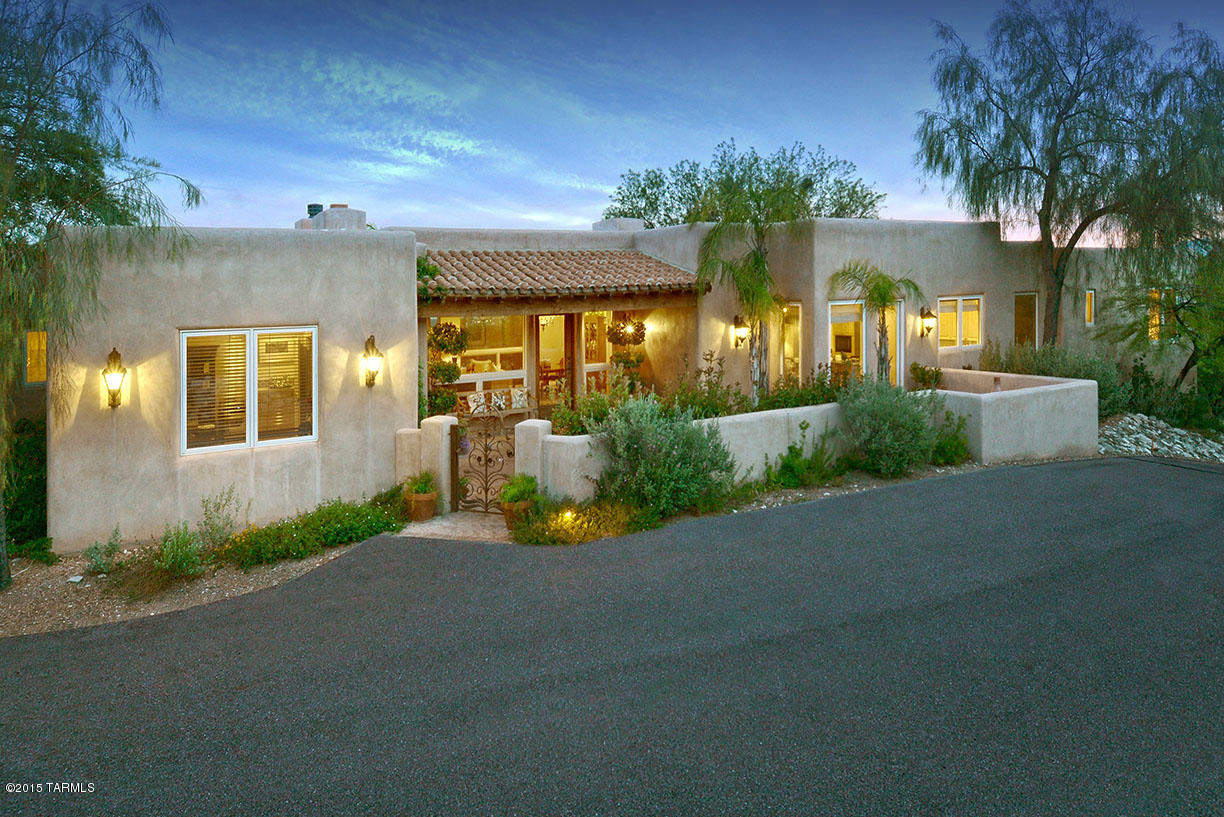 Elegant & classic Arizona Hacienda on 1.1 acres w/city & mountain views in prestigious gated Hacienda Del Sol Estates.Charming front brick courtyard w/fountain, exquisite living & dining rm w/wood beams,corbels, beautiful fireplace,walls of windows, gourmet island kitchen w/granite
countertops,stainless steel Dacor appliances,SubZero, butler’s pantry, breakfast area opens to family rm w/fireplace,polished concrete flrs,French doors,4 bedrooms + study(or 5 bedrooms),children’s wing w/
computer area,5 baths,(master w/travertine countertops,Jacuzzi tub, 2 walk-in closets,priv entry to the rear patio).Resort like bkyd w/ gas heated pool,spa,grass,cov'd brick patio,fireplace,outdoor kitchen w/granite bar area,BBQ,pizza oven,3 car gar,Dist 16,VIEWS! VIEWS! VIEWS! See Floor Plan under docum