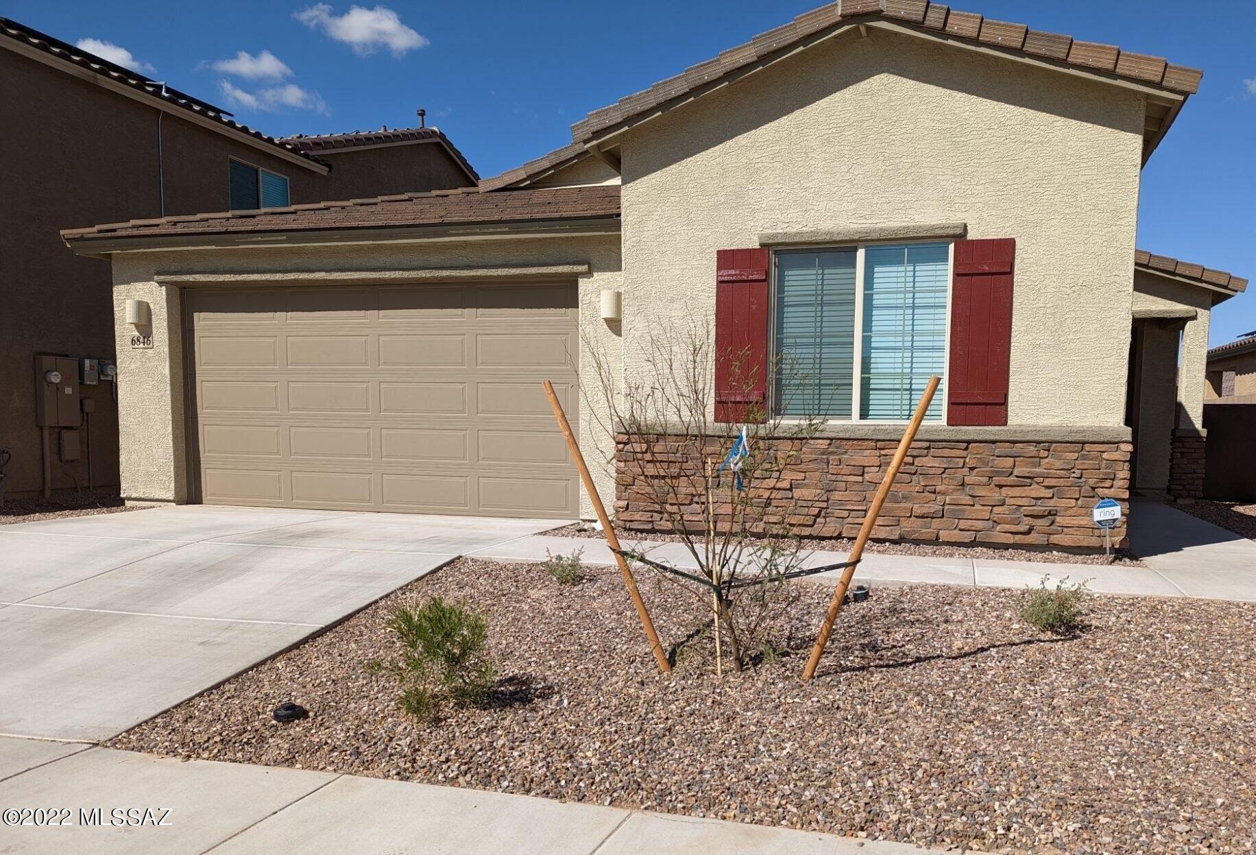 Welcome home to your Lennar-built Molino floorplan, completed in September 2021, it truly is better than new with custom blinds, ceiling fans, and a professionally landscaped yard.  The heart of the home is a large, open great room and an upscale kitchen with a huge island and granite countertops.  A flex room can easily operate as a home office or bonus room.  The backyard is beautifully landscaped with turf and pavers and it is directly across from one of the neighborhood parks, expanding your outdoor recreation options.  Located in the highly desirable La Estancia community where you will love the great selection of schools available within the award-winning Vail School District.  La Estancia has direct access to 'The Loop', an interconnected system of more than 120 miles of paved pathways and bike lanes, as well as a community pool, basketball court, and several beautiful parks.  La Estancia is within close proximity to many major employers, including Davis-Monthan AFB, Tucson International Airport, UA Tech Park, Raytheon, and Amazon. Come see this gorgeous home today!