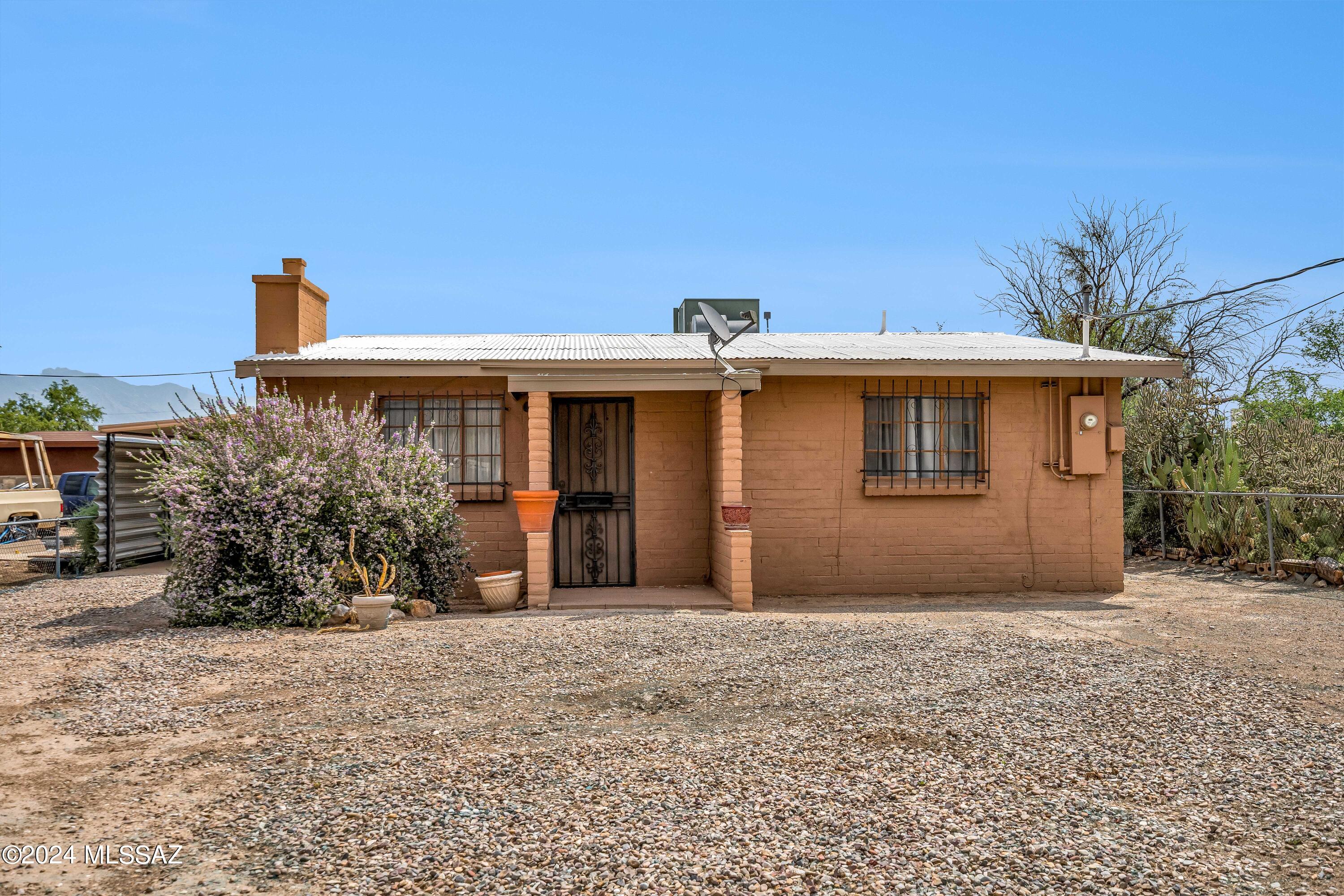Welcome to your new home in El Rio Acres, Tucson! This delightful 2-bedroom, 1-bathroom home offers a perfect blend of comfort and convenience. Inside discover a warm and inviting living space with abundant natural light. The spacious living room is ideal for relaxing or entertaining, while the well-appointed kitchen boasts ample cabinetry, a newer GE ss range, and a cozy dining area for family meals. Both bedrooms are generously sized, offering plenty of space and flexibility to fit your needs, whether it's a home office, guest room, or a serene retreat. The bathroom is clean and functional. Outside, you'll find a large backyard, great spot for hosting summer barbecues, gardening, or simply unwinding after a long day, this outdoor space has endless possibilities. Additional features include full pex plumbing, a convenient laundry area, and easy access to local amenities, including schools, parks, and shopping. Schedule a tour today and envision your new lifestyle in this charming Tucson gem!
