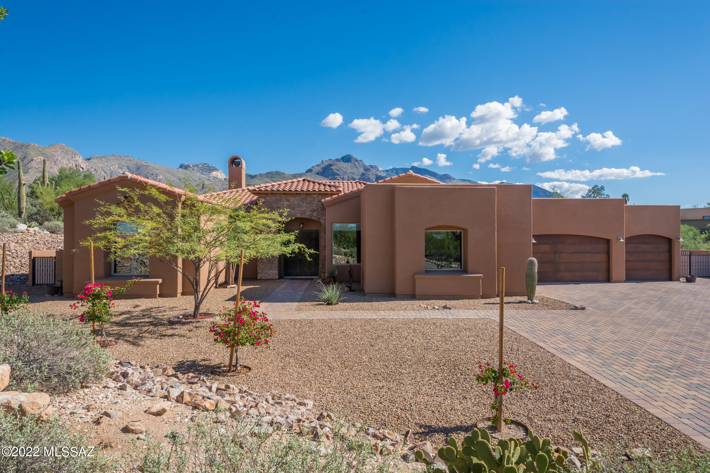 Come be mesmerized by the spectacular mountain views from the moment you enter this gorgeous 2014 foothills home featuring stacked stone detail, stunning gourmet kitchen/greatroom with huge picture windows, rich wood cabinetry, miles of exquisite granite, enormous island, breakfast bar, stainless steel appliances and gas cooktop. Spacious dining and living areas with dramatic fireplace and built-ins. Fabulous den, perfect for office/media room. Luxurious owner's suite offers a large walk-in shower, garden tub, dual vanities and amazing views. Massive walled in backyard with outdoor kitchen, extensive covered patio, travertine pavers and again...those views! Large format tile throughout, oversized laundry room and hard to come by 4-car garage. A rare find in the foothills and no HOA!