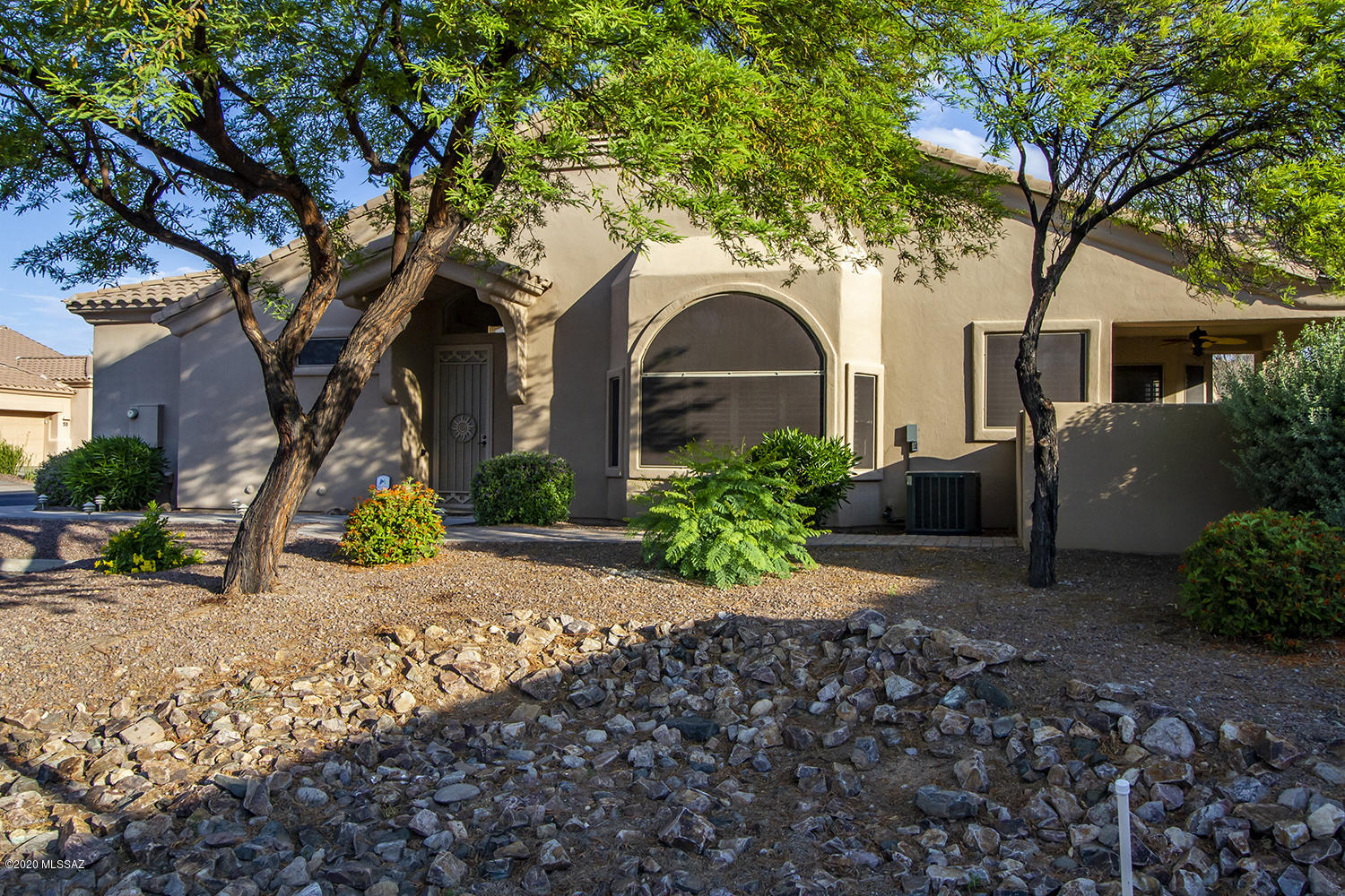 Exceptional 1593 sq. ft. Chula Vista Model, 2 Bd/ 2 Ba/ Den/, Catalina Mountain views, privac Guest parking. Extended patio w/water fountain, built in BBQ. fenced in backyard. 2018 AC/heater unit, 4 new ceiling fans, 2 new light fixtures, new carpet in both bedrooms. Gas fireplace. New appliances in kitchen and new washer/dryer. Remodeled master bathroom - new shower - new 36'' height vanity with sink. Bay windows in both bedrooms and kitchen area and great room with Shutters on all of the windows except for the sliding glass door. 28' x 78'' cabinets in garage, 10' x 40'' high work area in garage. Age restricted GATED community with 2 salt water pools and spa, Club house w/kitchen,  with work out room, billiard and card room, library. HOA includes water, trash,sewer,basic cable, exterior pest and termite control, roof maintenance & exterior painting of townhouse. Adjoining Hohokum park w/tennis, dog run, grilling facilities, and grass.