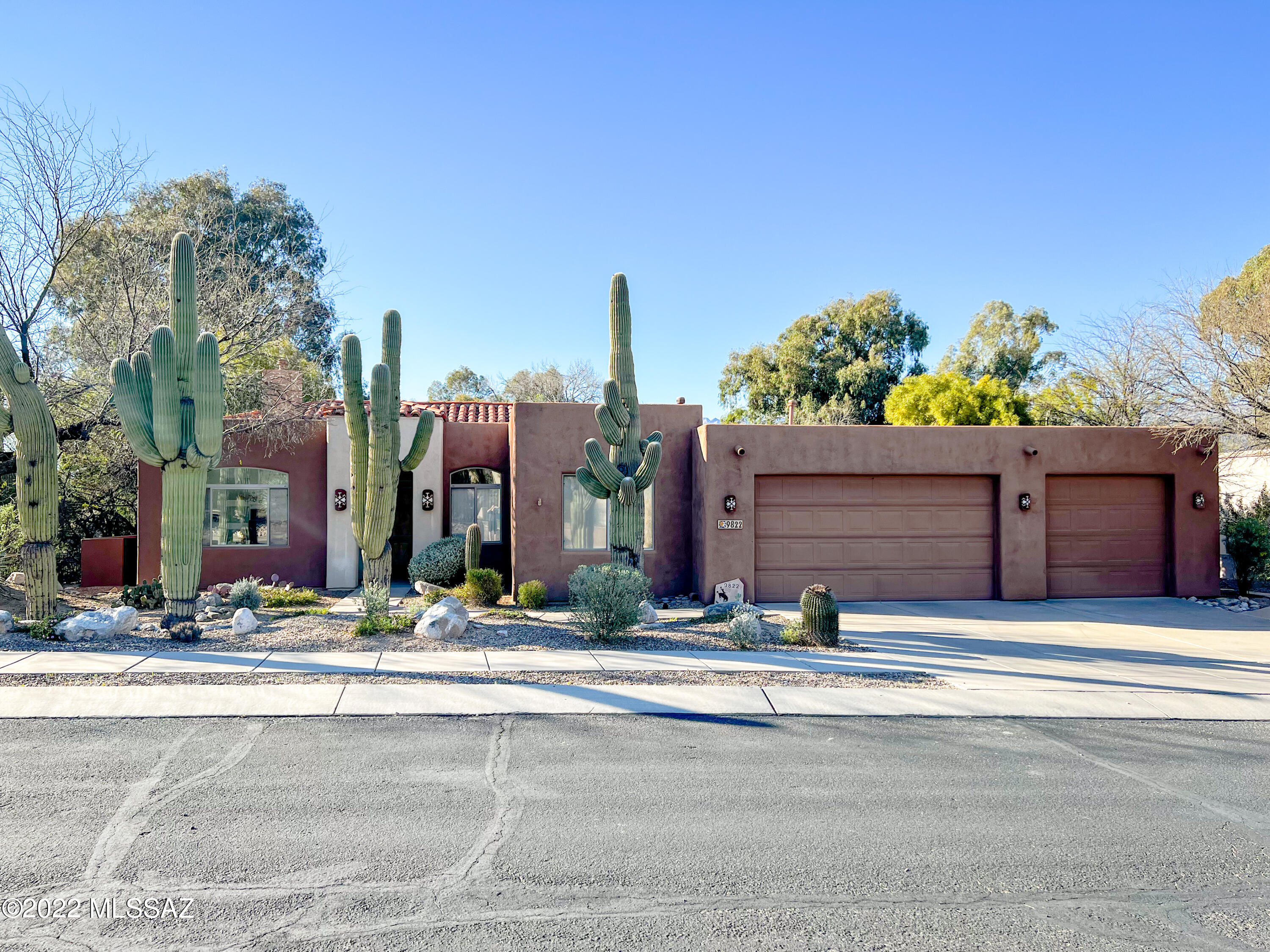 Seller to counter or accept offers from $775,000 to $850,000. Luxurious Pinterest perfect home located in a quaint enclave in Tanque Verde Valley! This home has 3 bedrooms, 2 baths, and 3 car garage with gorgeous Catalina Mountain views. Enter into the foyer to the soaring ceilings and open floor plan of 2,187 SF. Welcoming home promotes arched doorways, decorative wall niches, and exquisite fireplaces. The chef's dream kitchen is equipped with SS appliances including ZLINE dishwasher, gas range, microwave,  convection oven, and THOR refrigerator. This picture perfect kitchen has a farmhouse sink, two-tone modern cabinets, decorative tile backsplash, and island breakfast bar. The bedrooms are generous in size and have great closet space. The primary bedroom is glamorous with a sitting area near the fireplace. The en-suite bath features a separate soaking tub and shower, L-shaped dual vanities, and expansive walk-in closet. Step outside to enjoy your private backyard paradise. The covered patio offers a great space to BBQ and dine outside as your watch the sunset on the mountains. Cool off this summer by taking a splash in the sparkling pool. You will be in the heart of the valley, but still in close proximity to shopping plazas, Udall Park and the center of town. Schedule a showing today!