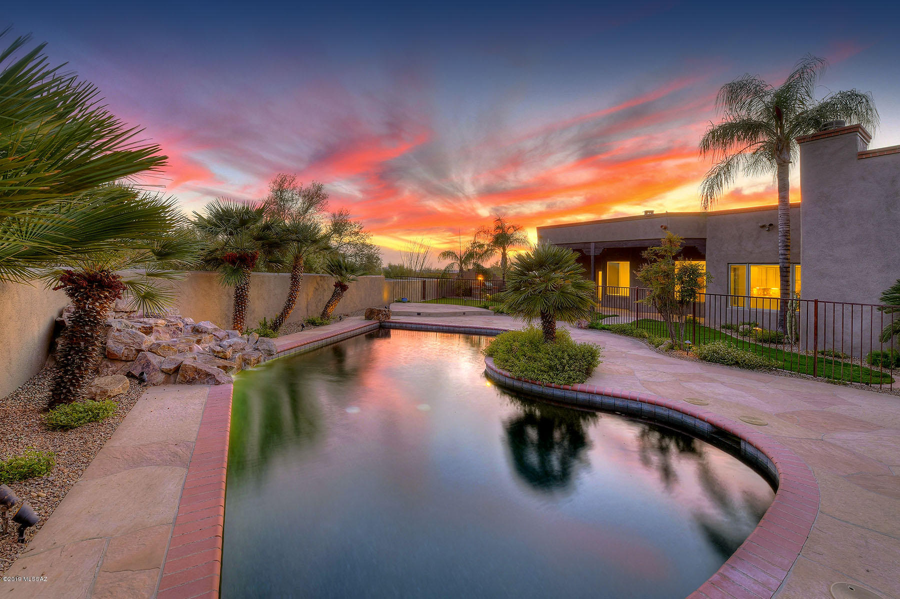Stylishly Remodeled 4 BR & 3 BA w/Office -  Custom Residence in Highly Coveted Central Foothills Location Close to Tucson's Finest Dining & Shopping. Updates Include: All New Windows, New concrete floors, Full Interior & Exterior Painting Including Staining of All Wood Doors & Beams, New Stainless Appliances, Full Roof Re-Coat, & New Irrigation System +Timer. Other Fine Features Include: Charming Courtyard Entrance w/Fountain, Open Floor Plan, Spacious Master Suite w/ Fireplace, Spa Like Bath & Showcase Walk In Closet. Circular Motor Court w/ 3 Bay Garage. Spacious Resort Style Outdoor Living Space w/Covered Patio, Sparkling Pool & Waterfall, Built in BBQ, Playground Area, Half Basketball Court & Stunning Catalina Mountain Views! Location! Location! Location!