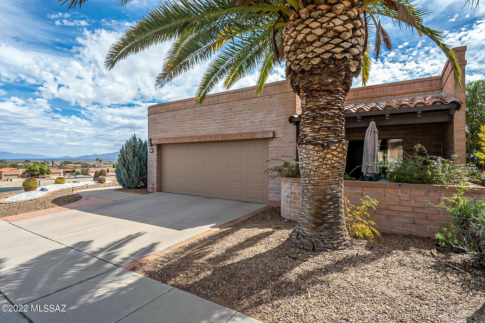 From dawns' early light, majestic mountain views prepare you for another day in Paradise...the spacious Miramar is your perfect desert home! Located on a premium corner lot that overlooks what used to be the driving range at Canoa Hills GC. The 2 BR/2 BA plus den is ideal for entertaining or staying in and cozying up to the fire of your Beehive FP. The bar in the LR has been capped off but is plumbed if you desire replacing the wet bar. The updated kitchen and baths with gorgeous cabinetry and granite countertops are bathed in light from skylights. So much room in the spacious Owner's suite with fabulous VIEWS! Large bath with executive height double vanities and walk-in closet. Guests are treated to privacy with their very own west facing patio. Enjoy the desert at it's best! Hot water is available immediately throughout the home saving our precious water. If leaving for an extended time, water can be turned off to the home, and left on for the plantings in your yard. Extended garage has plenty of storage cabinets and a large storage room. The safe and water softener convey as is.