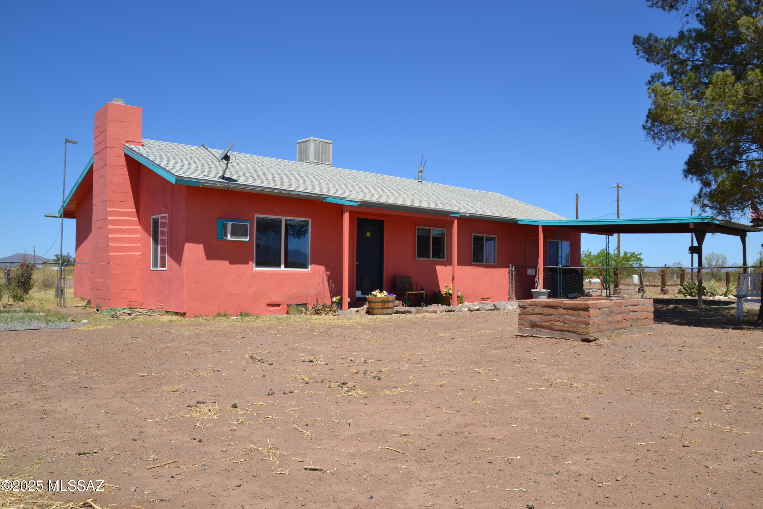 Escape the city and enjoy serene country living while remaining conveniently close to Bisbee, Douglas, and Tombstone. This versatile 4-bedroom, 1.5-bathroom home offers endless possibilities, with the 4th bedroom easily adaptable as a family room, home office, gym, or formal dining area. 
The spacious laundry room provides ample space for storage or additional workspace. Recent updates include new mini splits for heating and cooling (with the option to use the furnace and evaporative cooler), a new hot water heater, whole home water softener system and several new windows throughout. Outdoors, the property boasts a private well, a large workshop with power and an electric door, and a full RV hookup with a 50-amp breaker, RV dump, and a 13x40 concrete pad. The roof is approximately 10 years old, the exterior has been freshly painted with a charming southwest flair. Fiber Optic cable line installed at lot line!
With so much potential and a fantastic location, this property is perfect for those seeking a peaceful retreat with modern conveniences. Don't miss out on this unique opportunity!