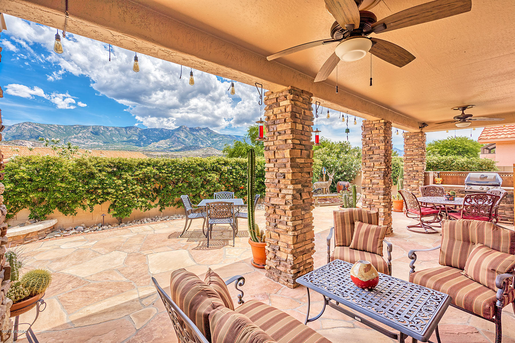Open great room, wonderful mountain views, 2.5 car garage + separate Casita. This Barcelona model has been totally renovated & upgraded to an open floor plan w/a welcoming courtyard & guest casita.  Great room features a wall of windows overlooking the mtn  view, custom entertainment center w/room for large TV. Renovated kitchen boasts gas cooktop, double oven & granite counters. Master w/en-suite w/large soaking tub, walk-in shower, double sink vanity & spacious closet. Guest room & updated guest bath completes the main home. Outside is for entertaining w/expanded flagstone patio, misting system, built-in BBQ & beautiful mountain views. 2.5 car garage, paver driveway, stacked stone façade, diagonal tile, & plantation shutters makes this your ideal SaddleBrooke home.