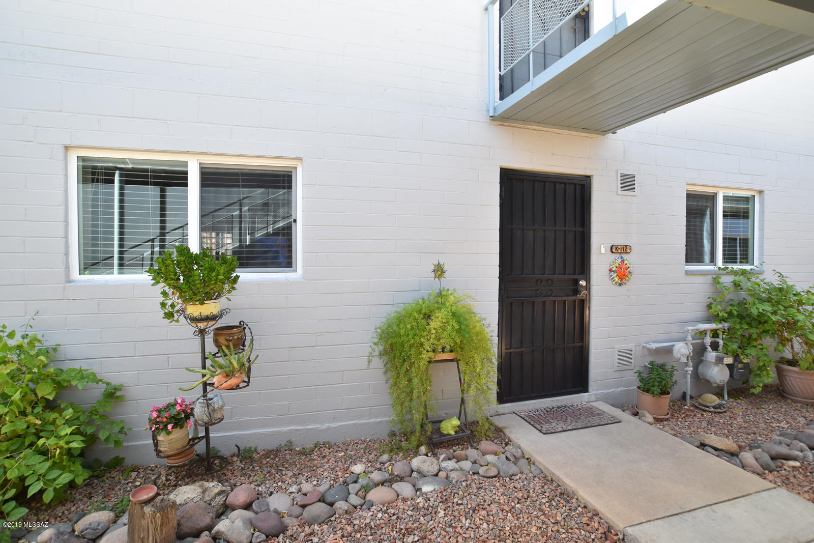 Highly desirable lower level, remodeled unit with 2 Bedrooms! These don't come on the market often, so here is your chance! Beautifully remodeled and freshly painted in a warm palette giving a comfortable ''Old World'' aesthetic. New high end Spanish tile flooring throughout. Newly tiled, ample sized ''edgeless'' shower! Kitchen update includes stone back-splash. All new, high end plumbing fixtures throughout the unit. Brand new replacement windows! Near Golf, Zoo, Shopping, Maintenance free HOA fees include plumbing,water, trash, sewer, insurance and taxes.Also HOA covers Heating/ Cooling and Hot Water heater repair and replacement. Maintenance FREE!!! Everything has been done so you don't have to do anything but move in and enjoy! Life is good!
