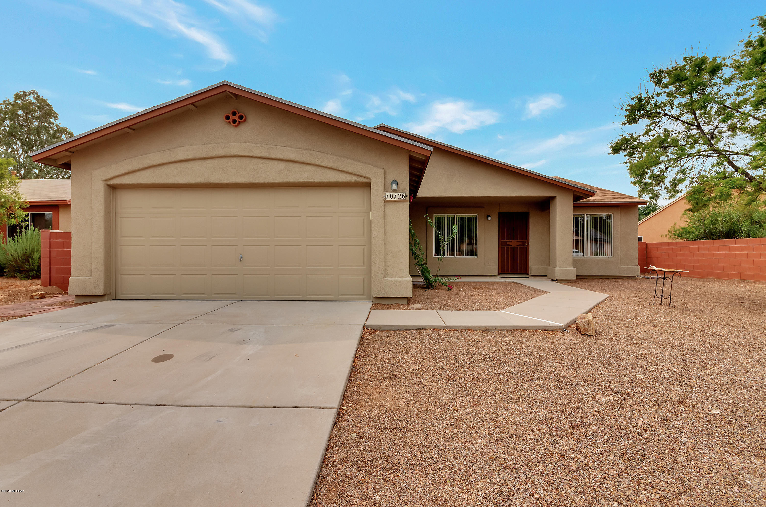 Desirable Rita Ranch home for sale with a pool! A highly sought after floor plan with split bedroom suite. Roomy master with full bath and walk in closet. Bath features separate shower and soaking tub. Kitchen opens to family room with high ceilings. Place for bar stools and eat-in kitchen nook with bay window. Handsome ledge for decorations above cabinets. Clean, sharp, ready to move in to. Windows washed, carpets cleaned, ready to go. 3 bedrooms plus den. Pool is fenced for security, covered patio and separate play yard. Jungle gym is included. Exterior freshly painted and new roof. North/South orientation. Show with confidence.
