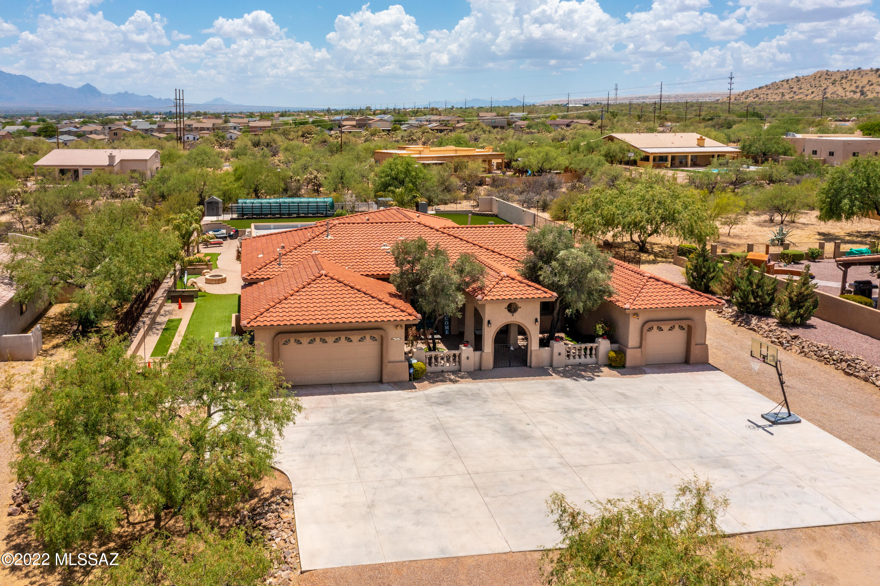 Are you looking for Luxury, Location and Lifestyle, well look no more! This 4 bd, 2.5 bath + 2 dens, 2 Garages- 1 dbl car/ 1 sgl car, is ready to be your home! Home features split floor plan. The kitchen has granite countertops, custom cabinetry and breakfast nook.The backyard has it ALL! Large pool with rock grotto, waterfall, swim up bar, hot tub, lagoon, in-ground trampoline, huge 5500 sq ft turf field with night lighting, greenhouse/ garden with hydroponics, horseshoe area, natural gas fire pit and covered patio. The sunken gazebo comes with built-in natural gas BBQ & mini fridge.